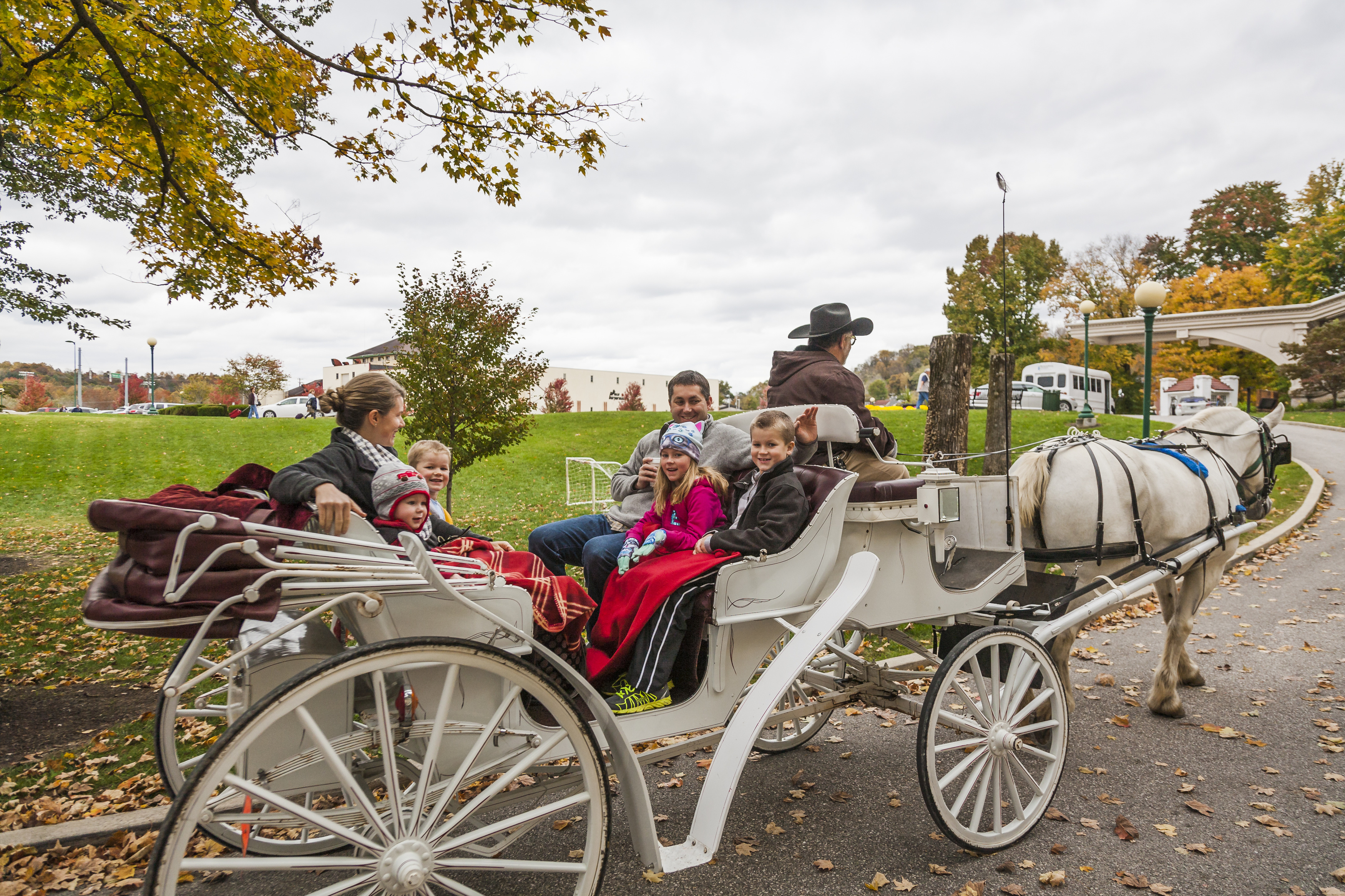 a group of people in a horse carriage