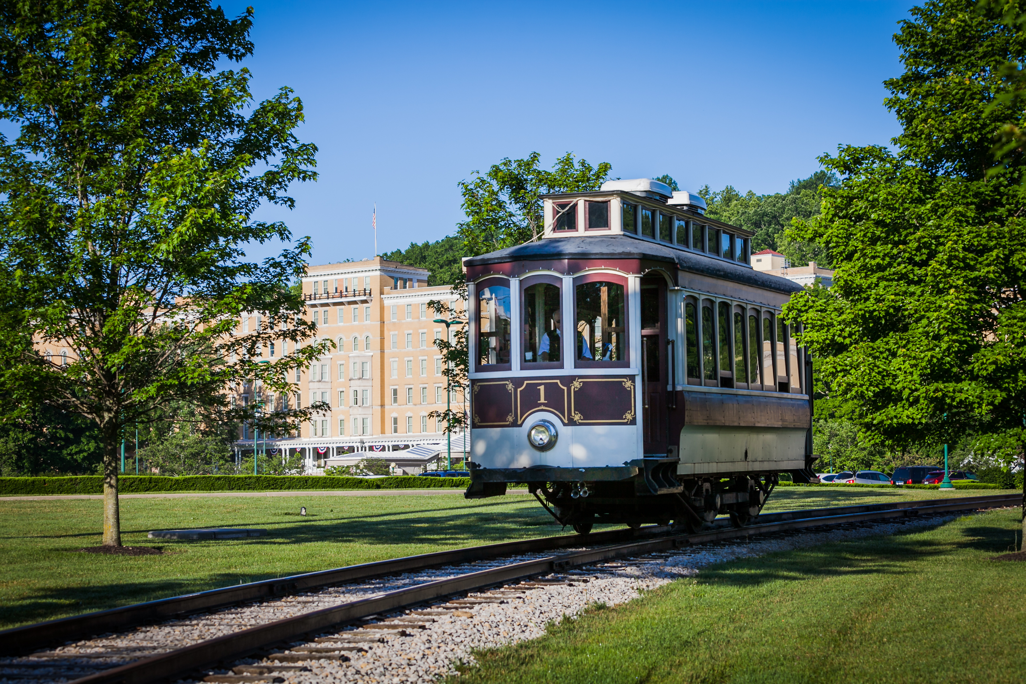 a train on tracks in a park