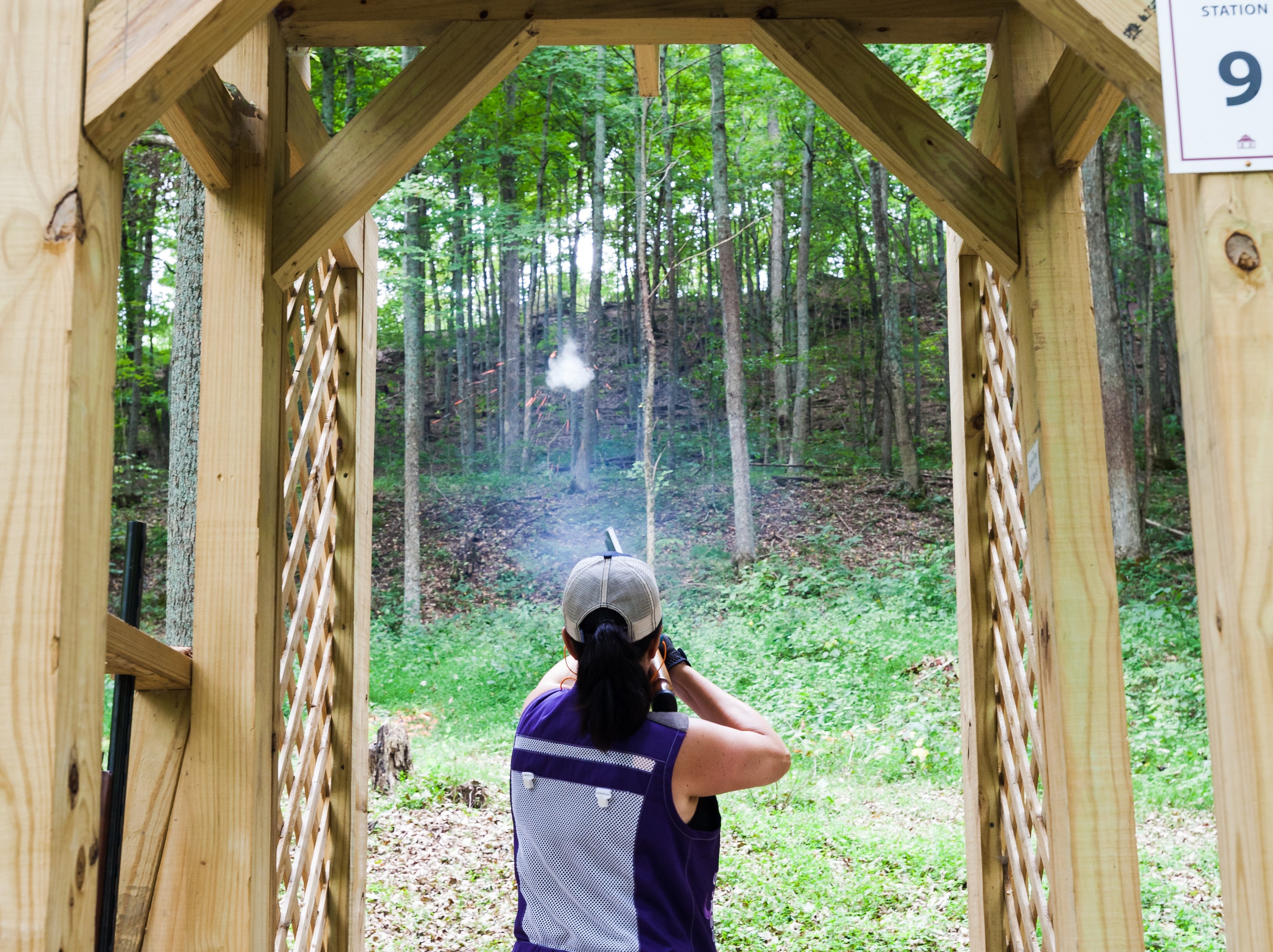 a woman shooting a gun