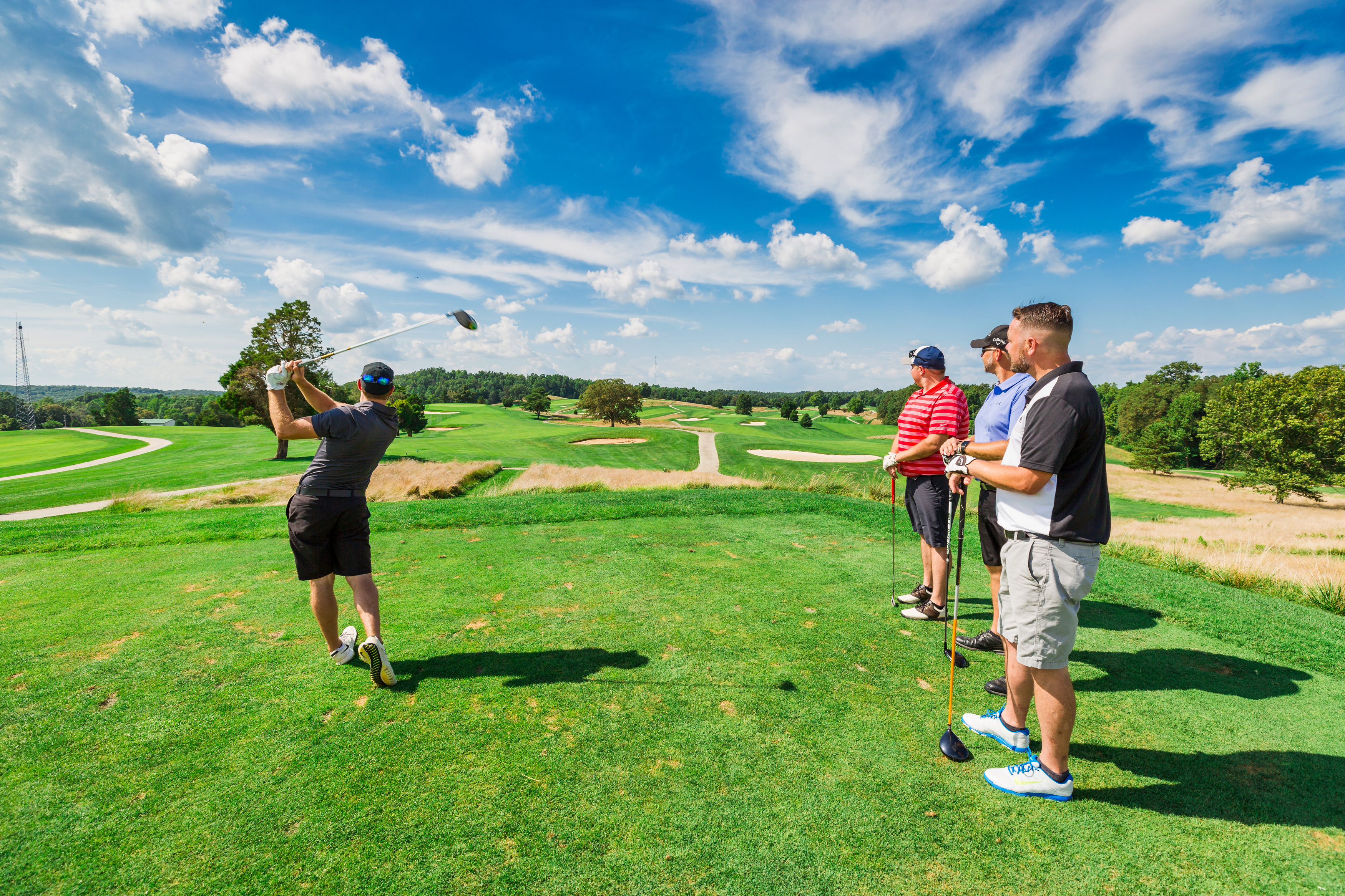 a group of people playing golf