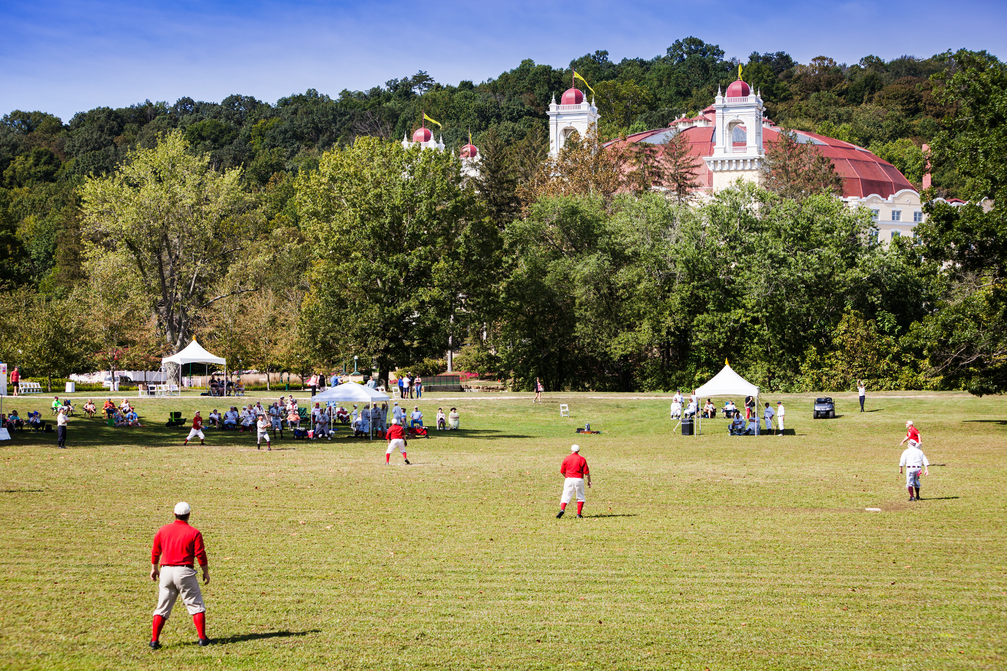a group of people playing football in a field