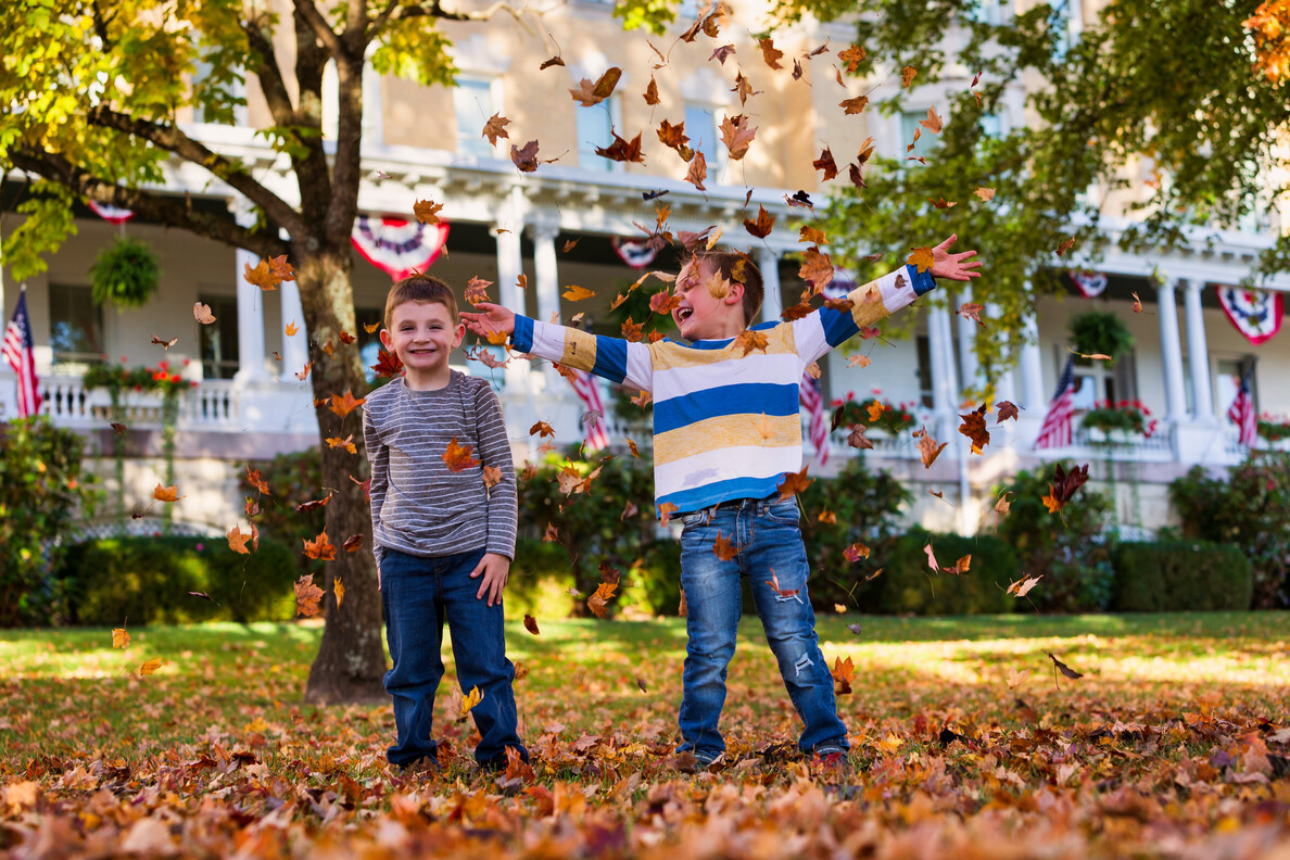 Kids playing in leaves