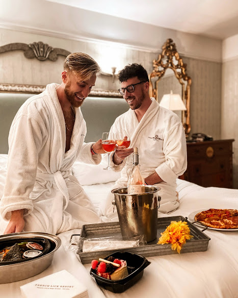 two men in robes eating room service