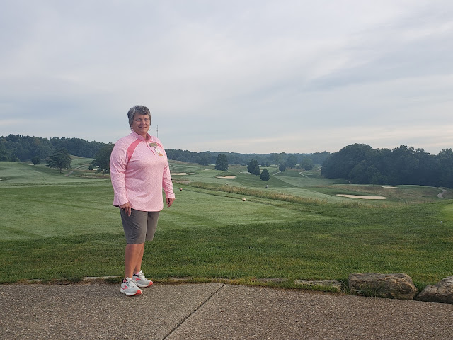 Lori Astedes overlooking golf course