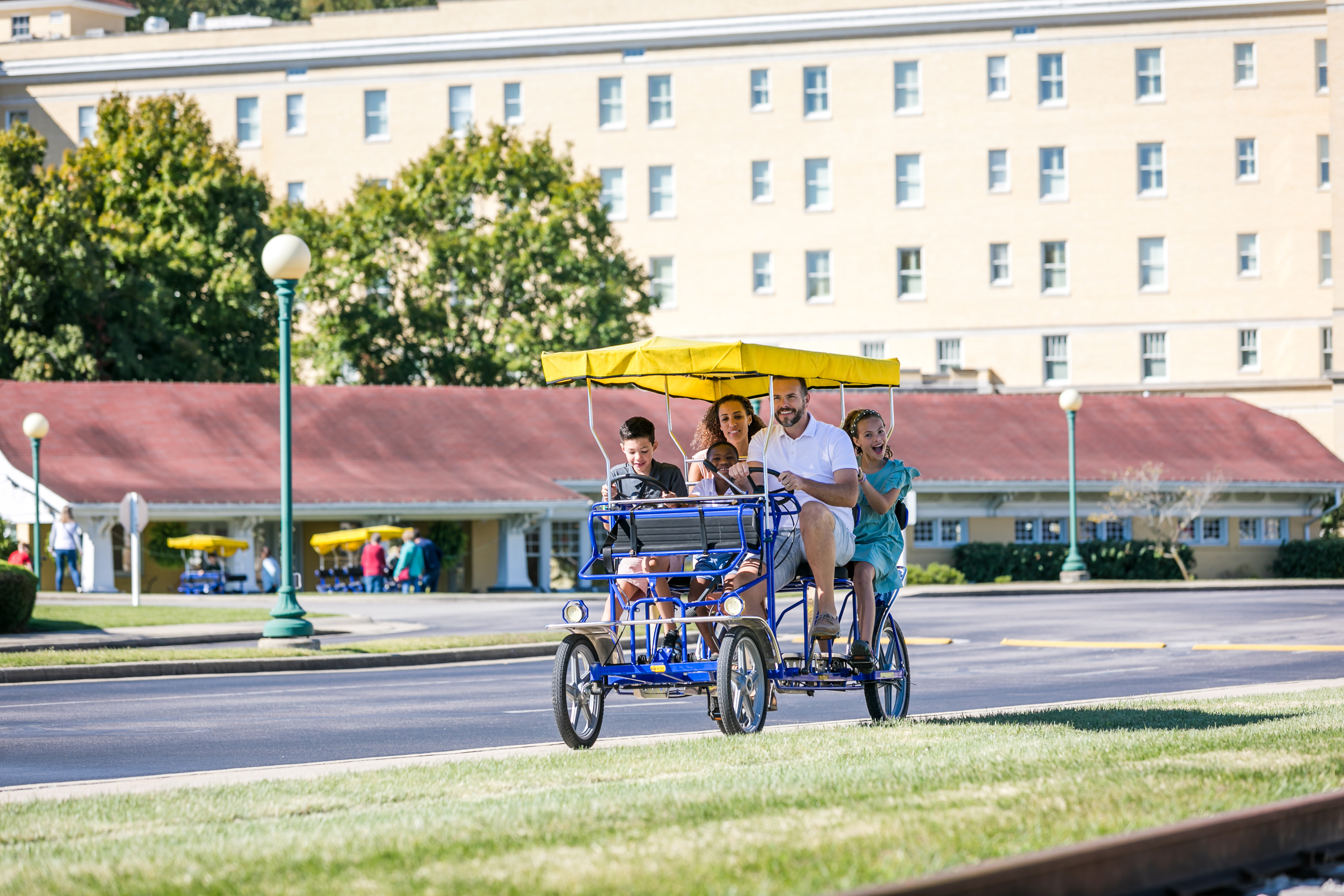 a group of people riding a bicycle
