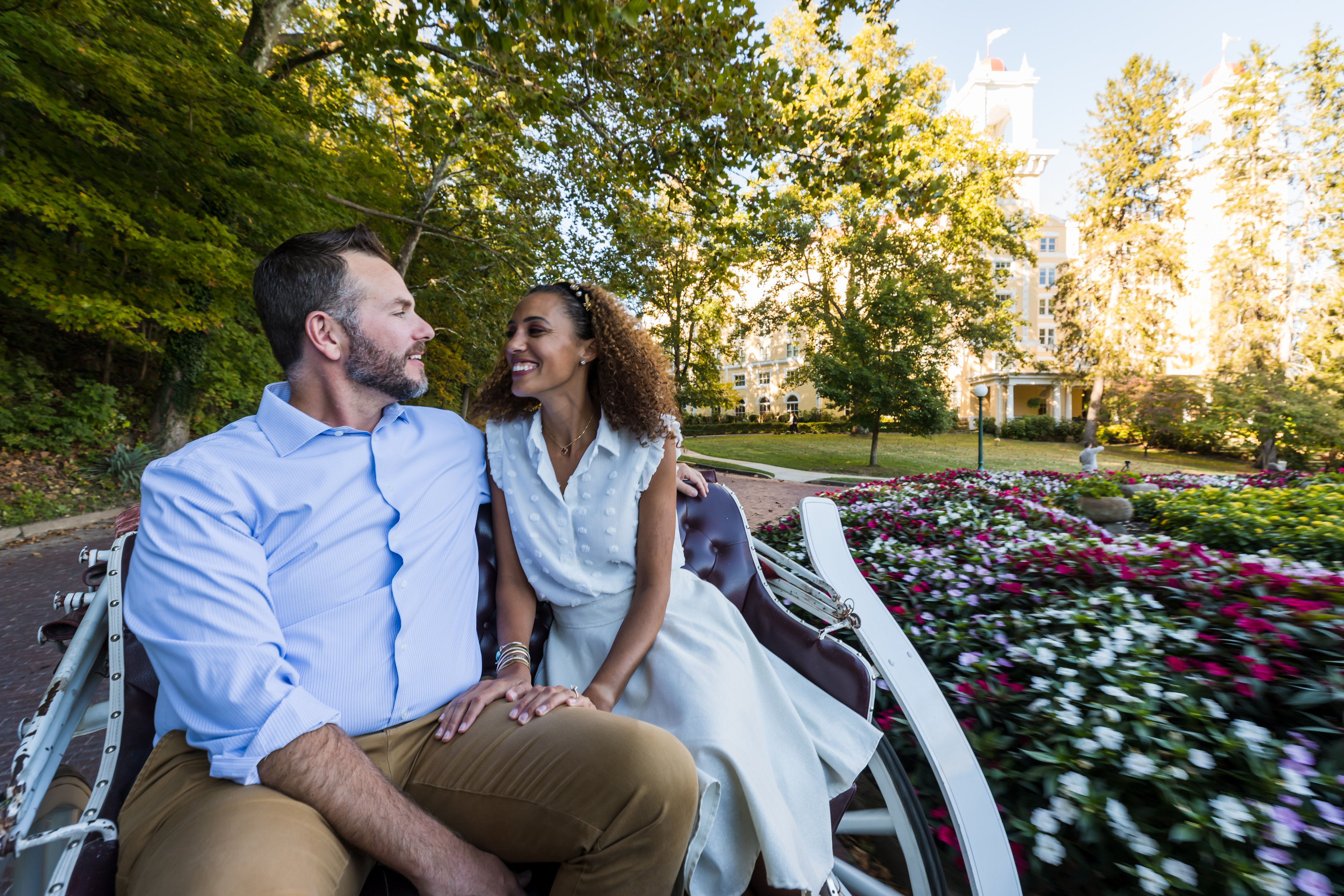 a man and woman sitting on a bench