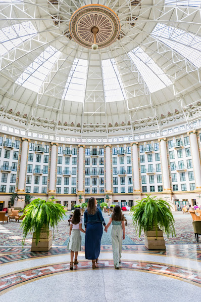 mother and two daughter touring west baden springs hotel