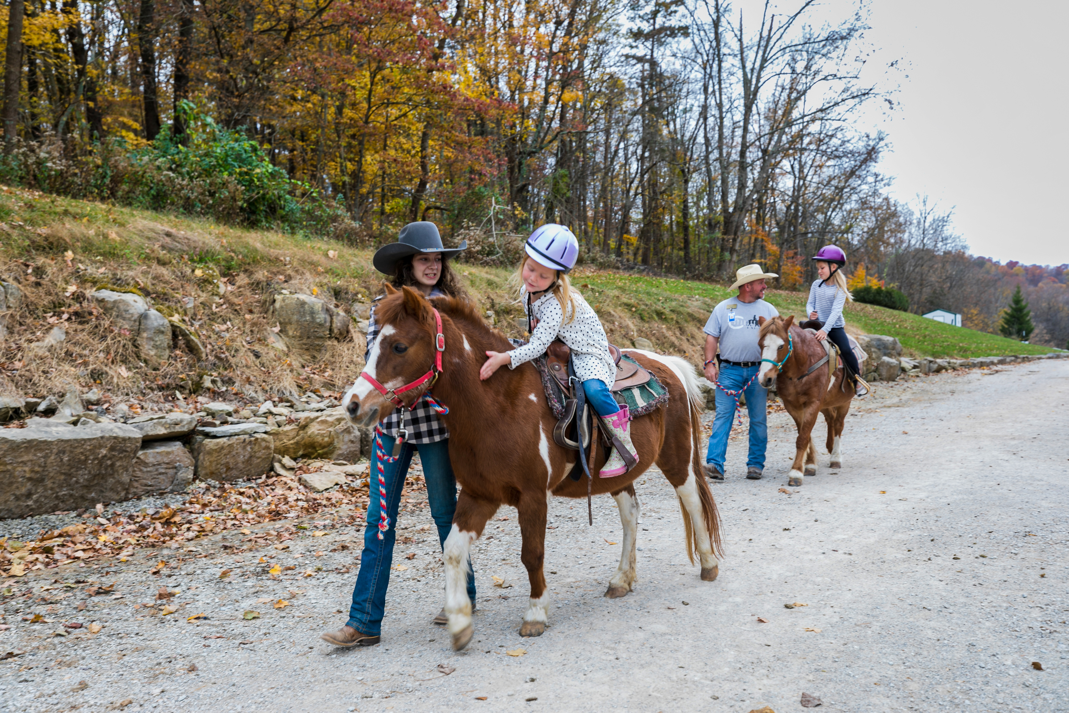 a group of people riding horses