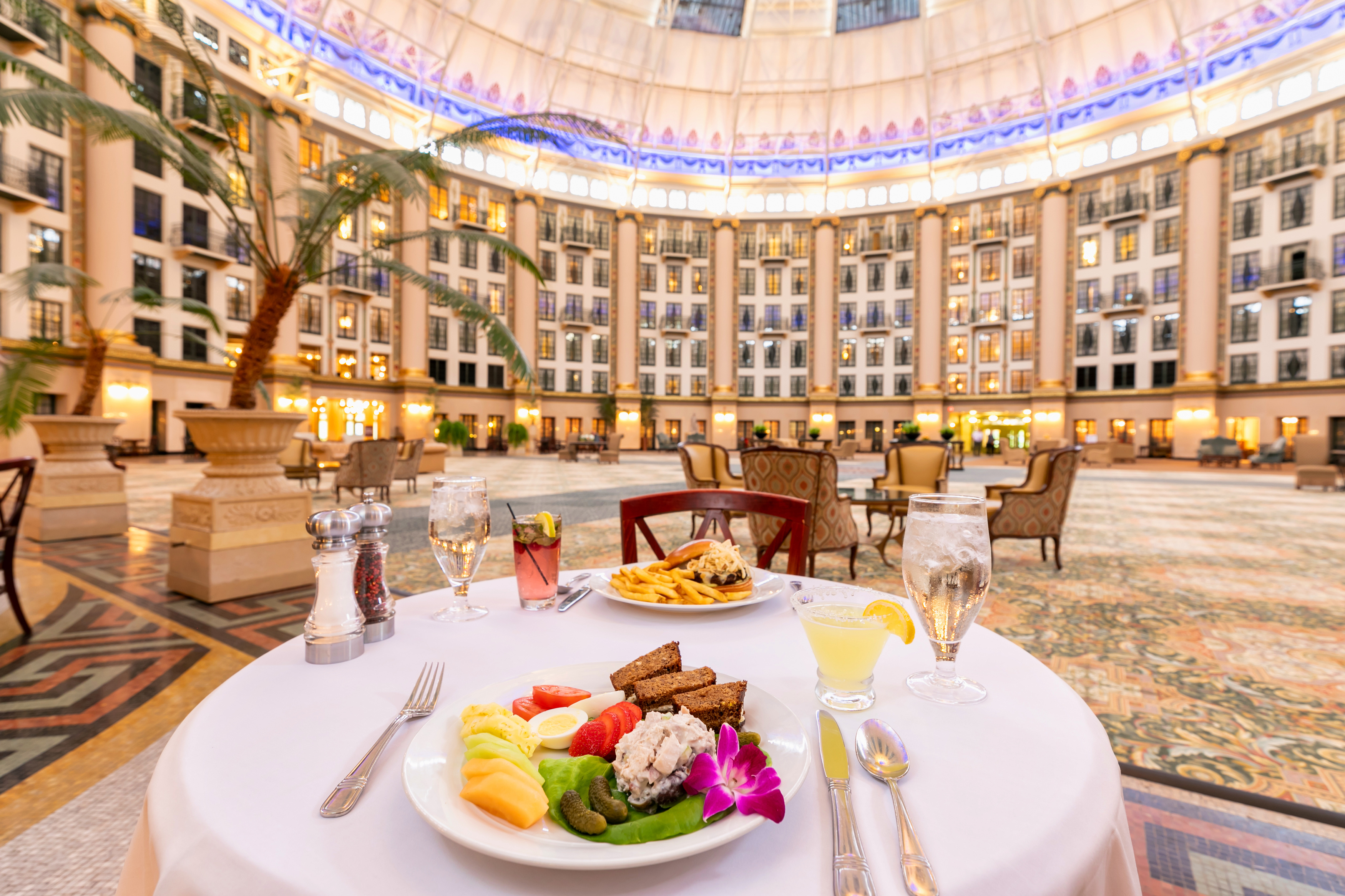 a table with food on it in a room with a dome ceiling