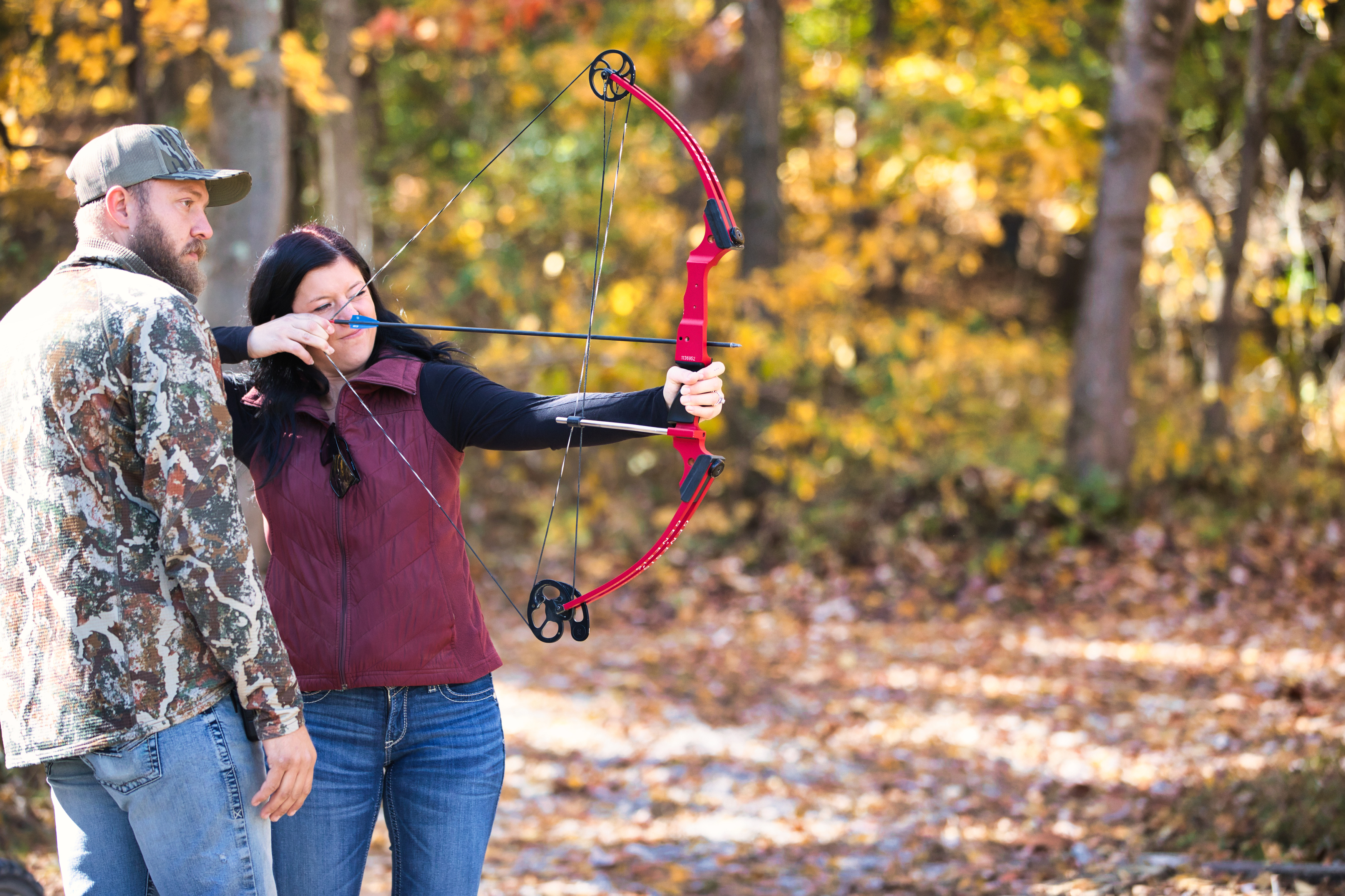 a woman shooting a bow and arrow