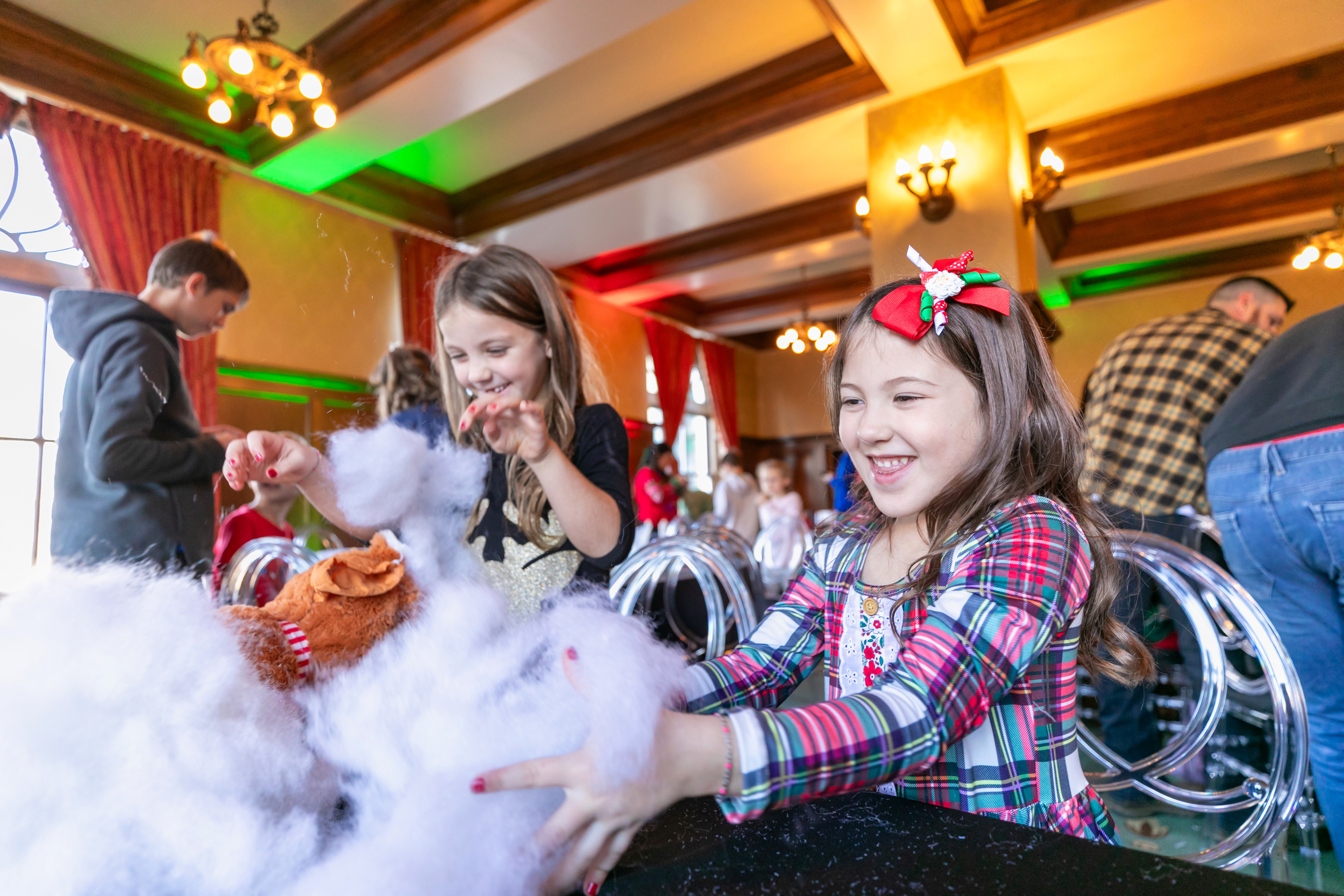 a group of kids playing with cotton candy