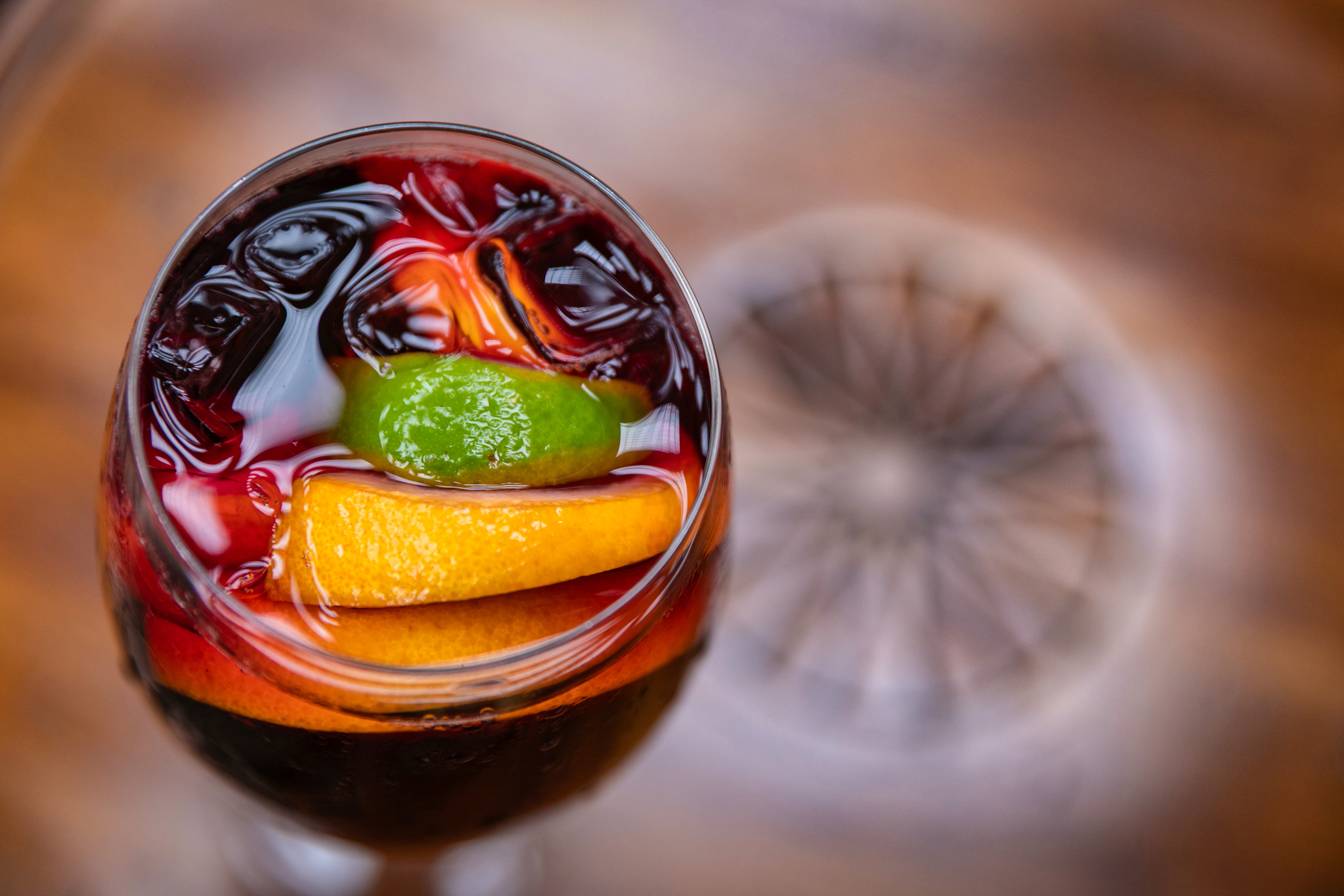a glass of wine with a fruity drink