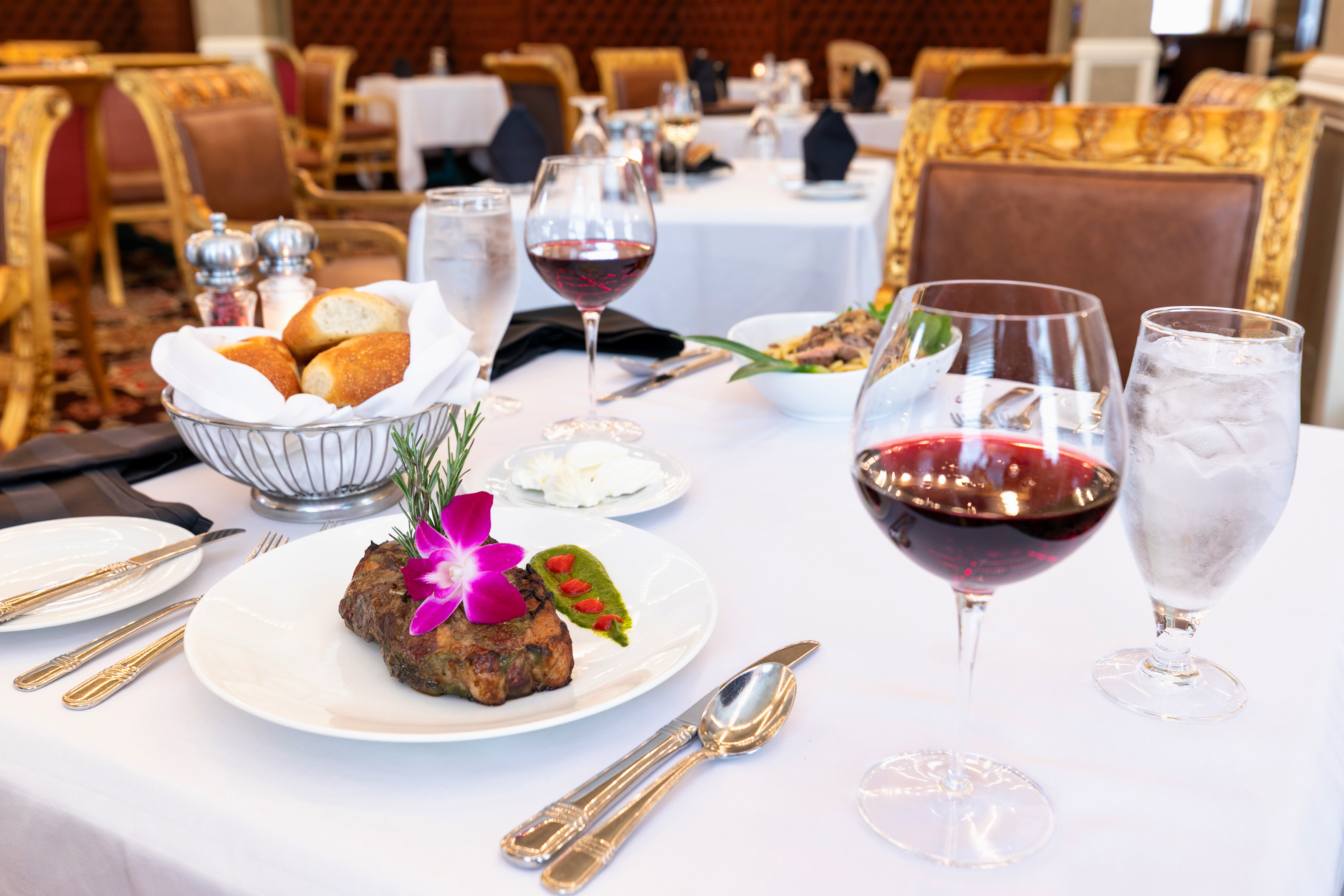 a table with food and wine glasses