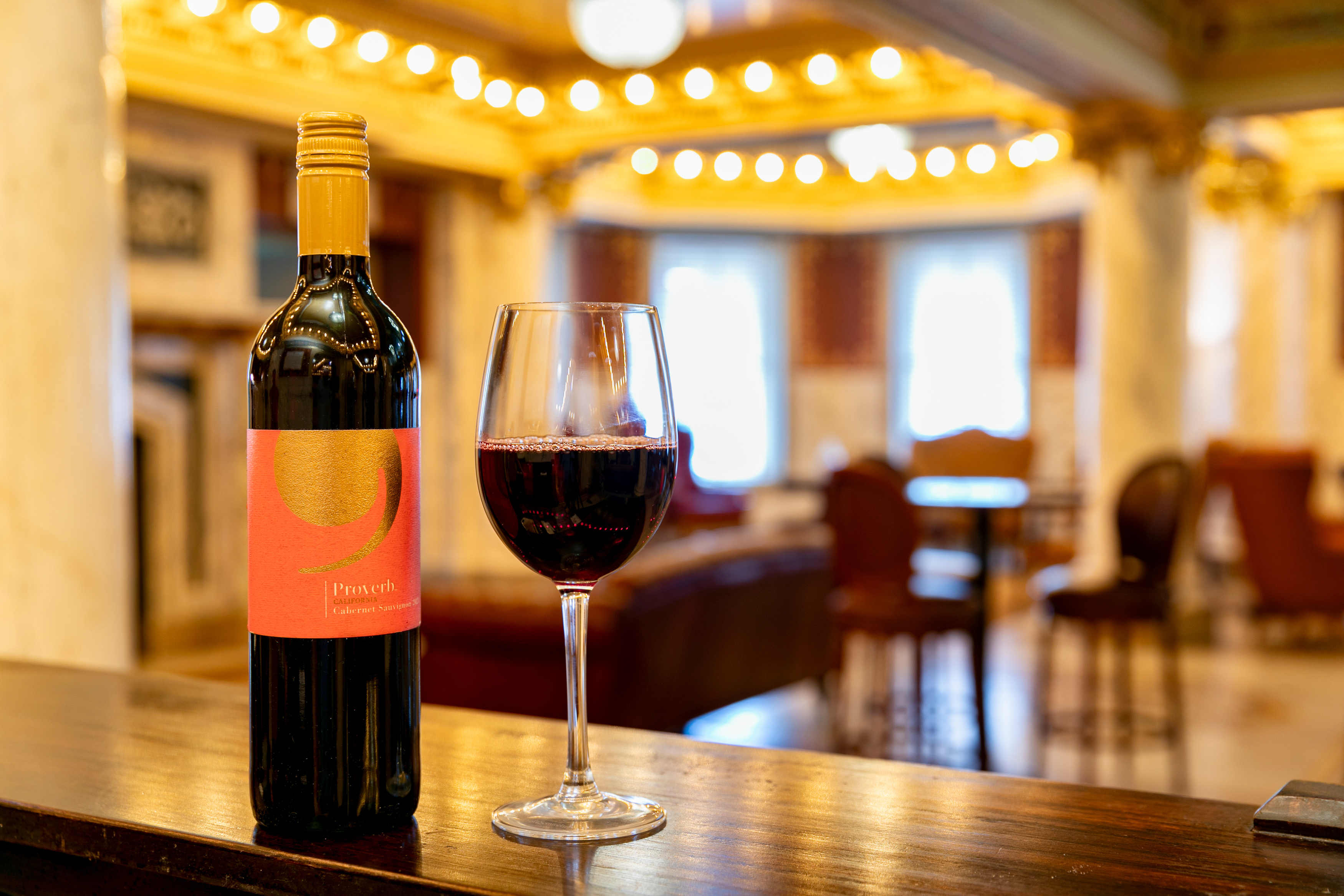 a bottle of wine and a glass of wine
