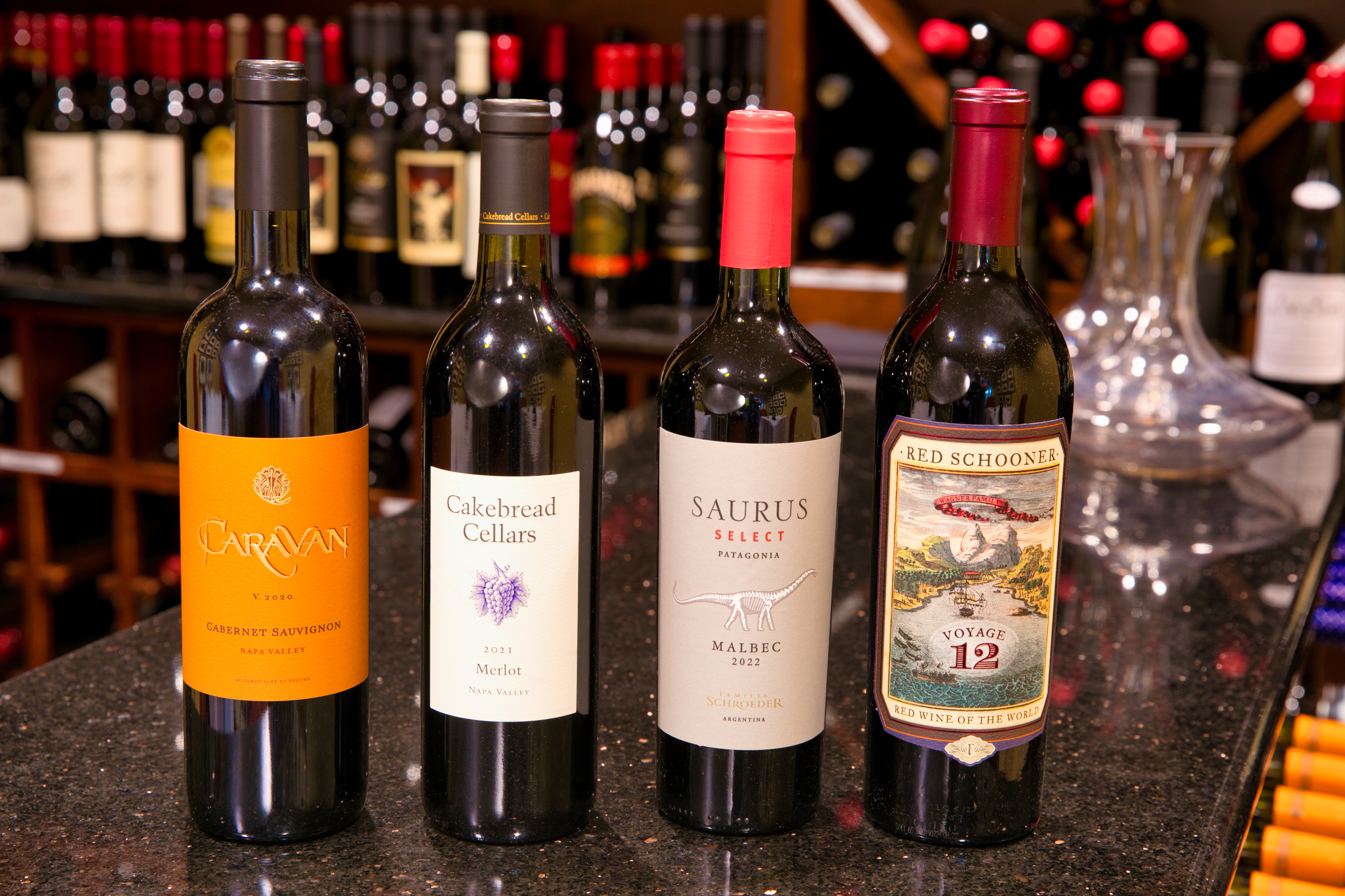 a group of wine bottles on a counter