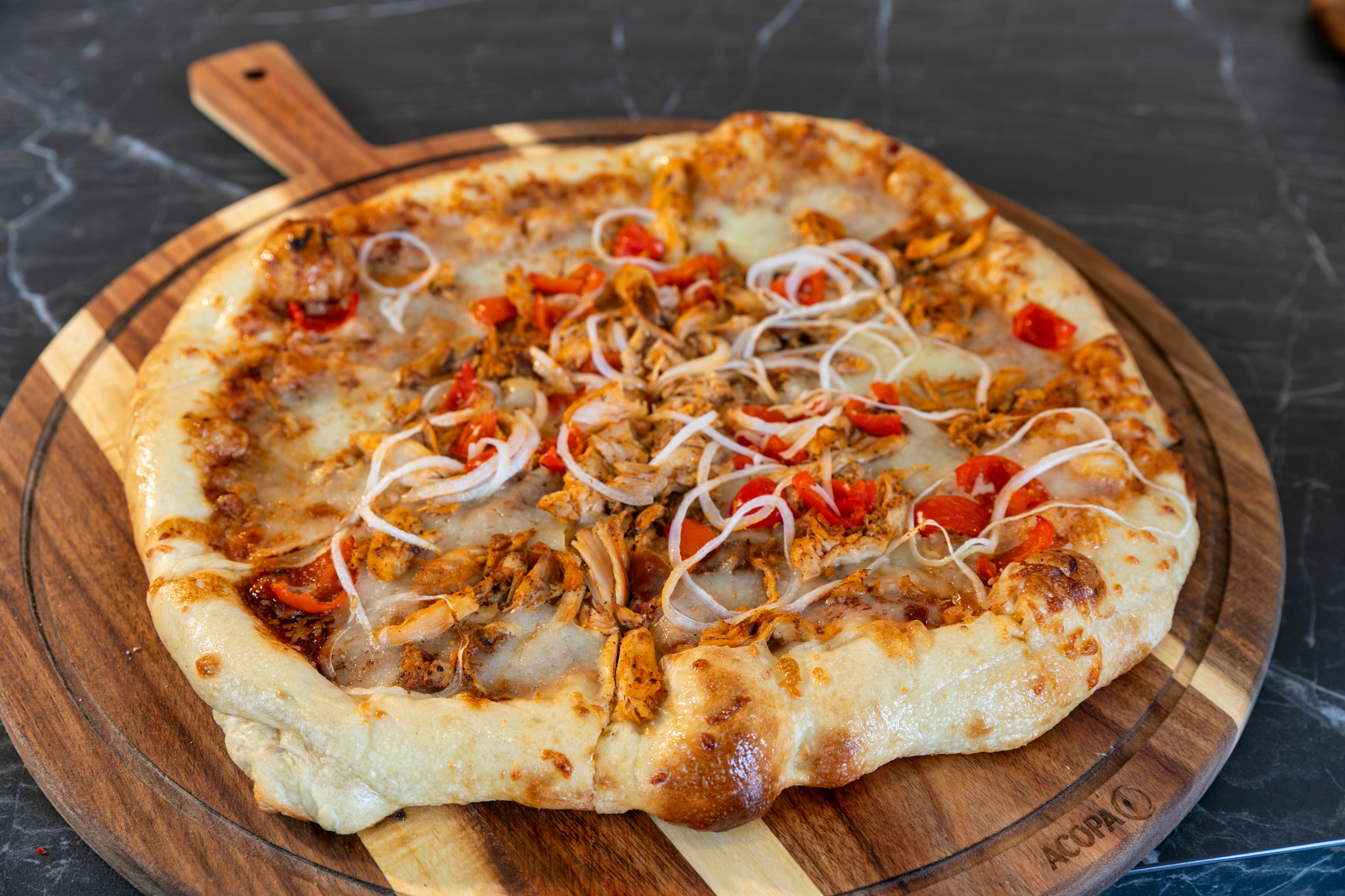 a pizza on a wooden board