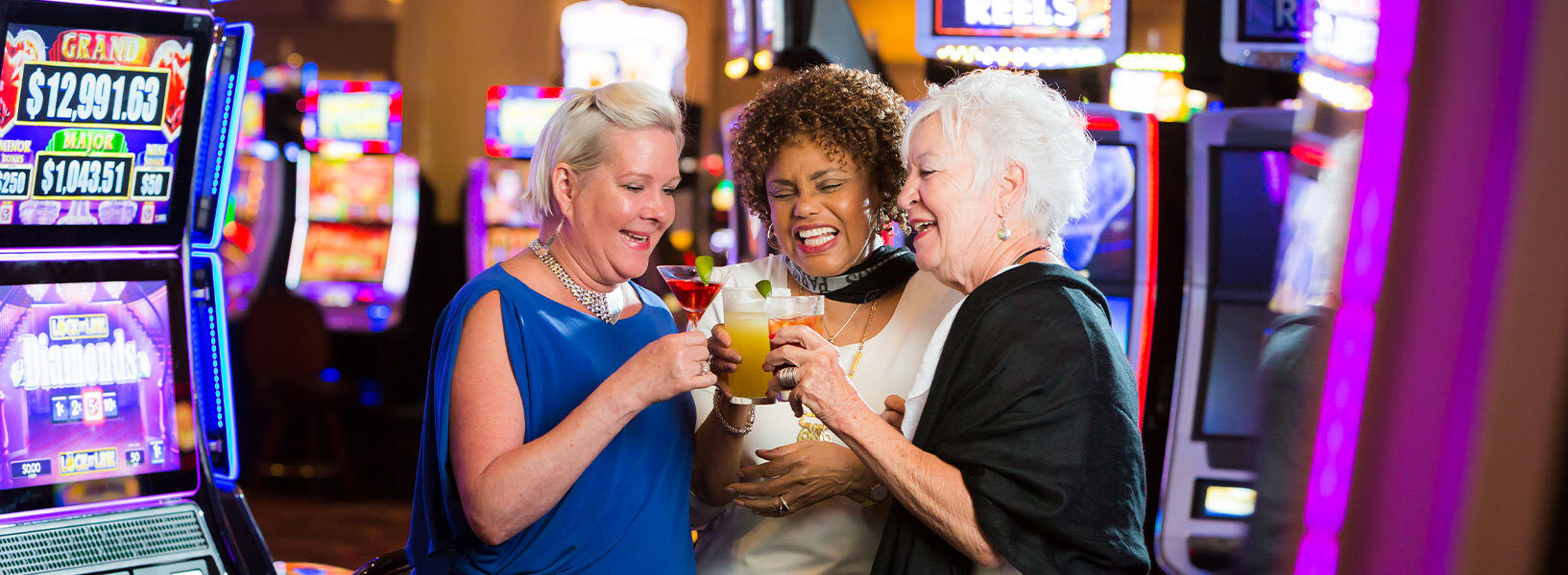 Ladies toasting cocktails at the casino