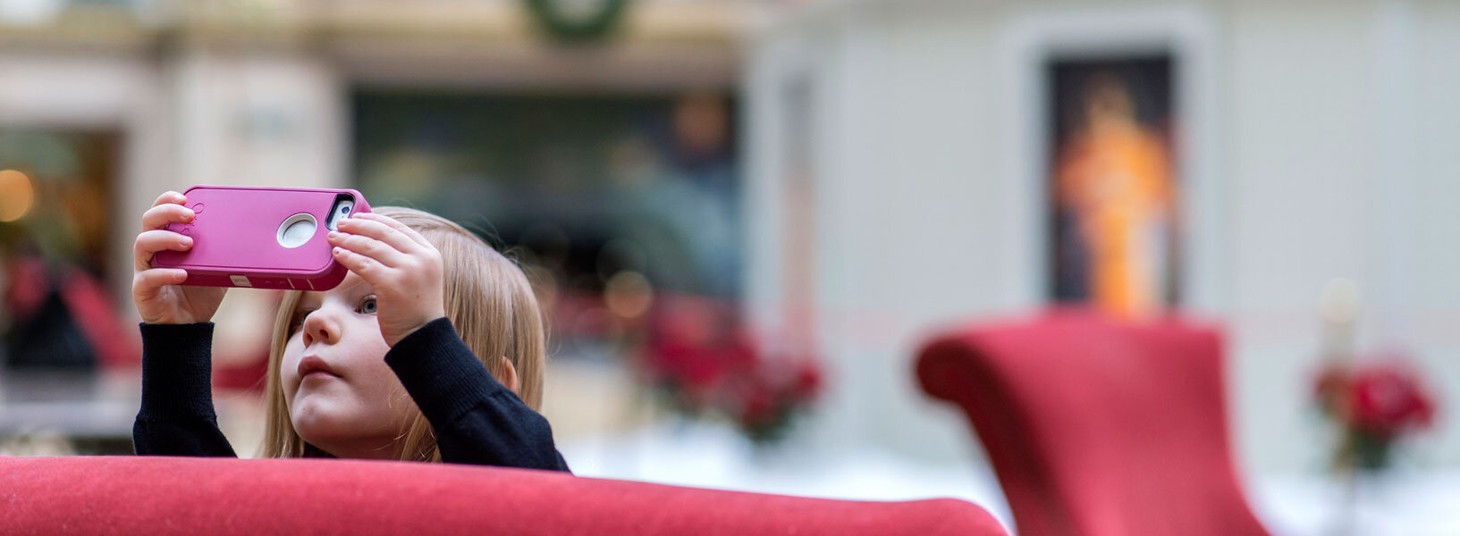 little girl taking picture in the atrium