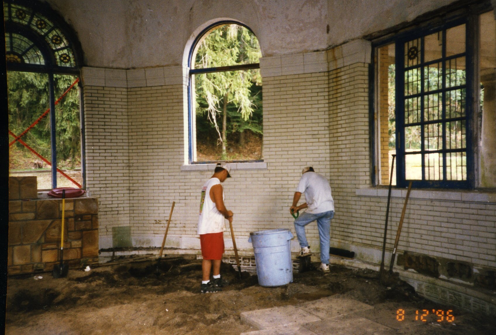 a couple of men working in a room