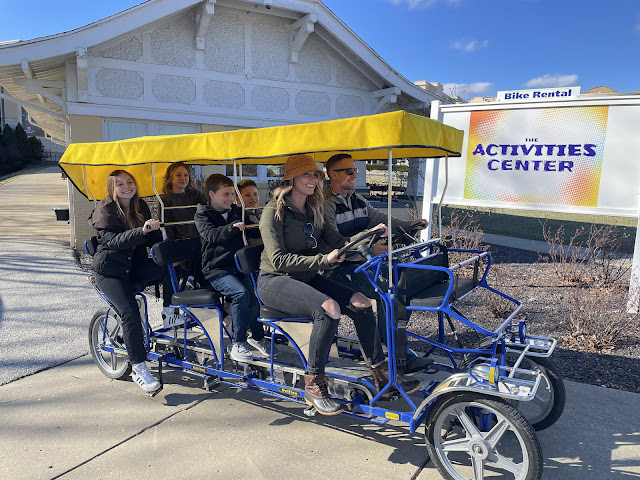 family on pedal trolley