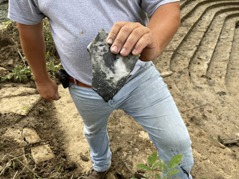 man holding a piece of marble