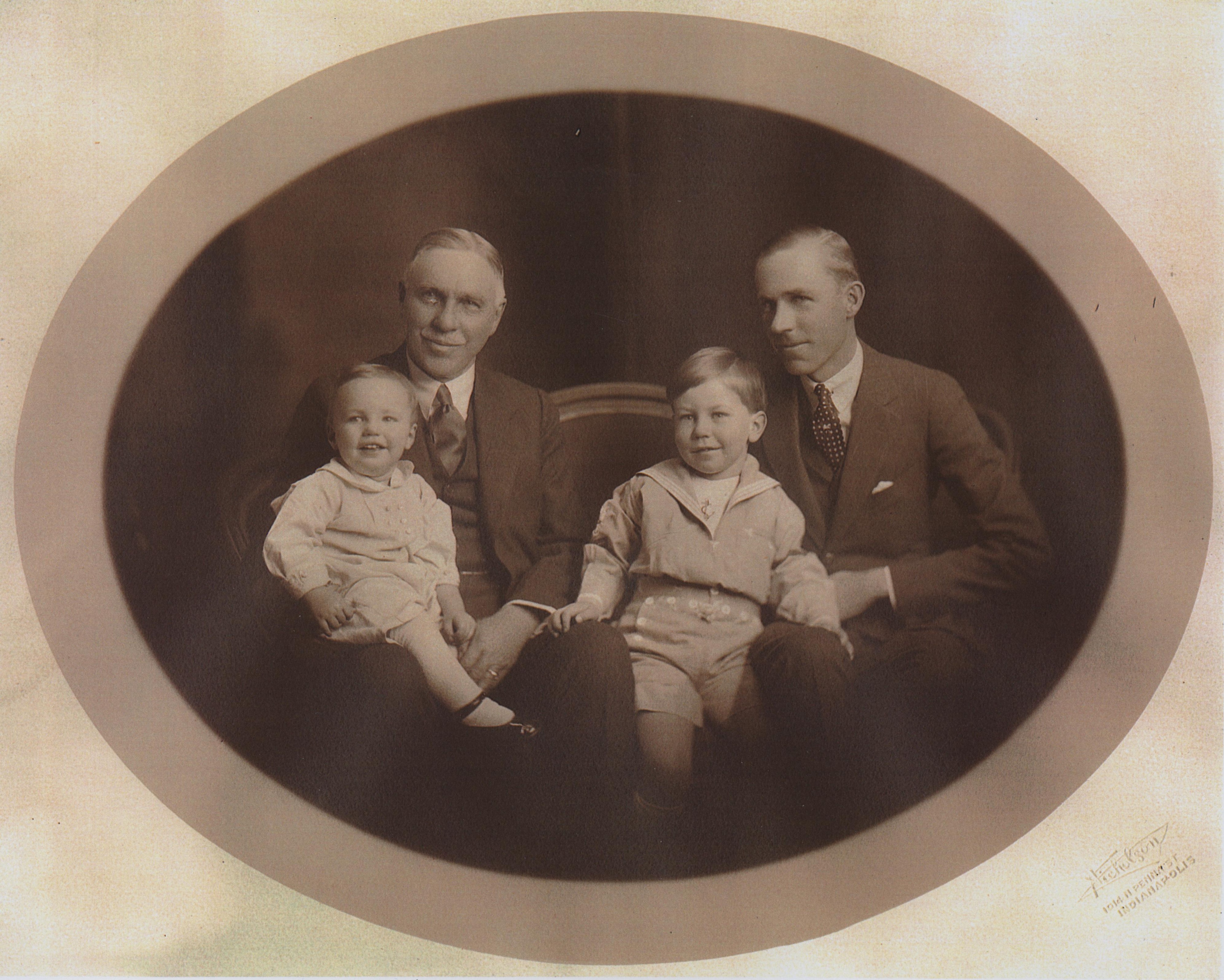 A black and white photo of a family
