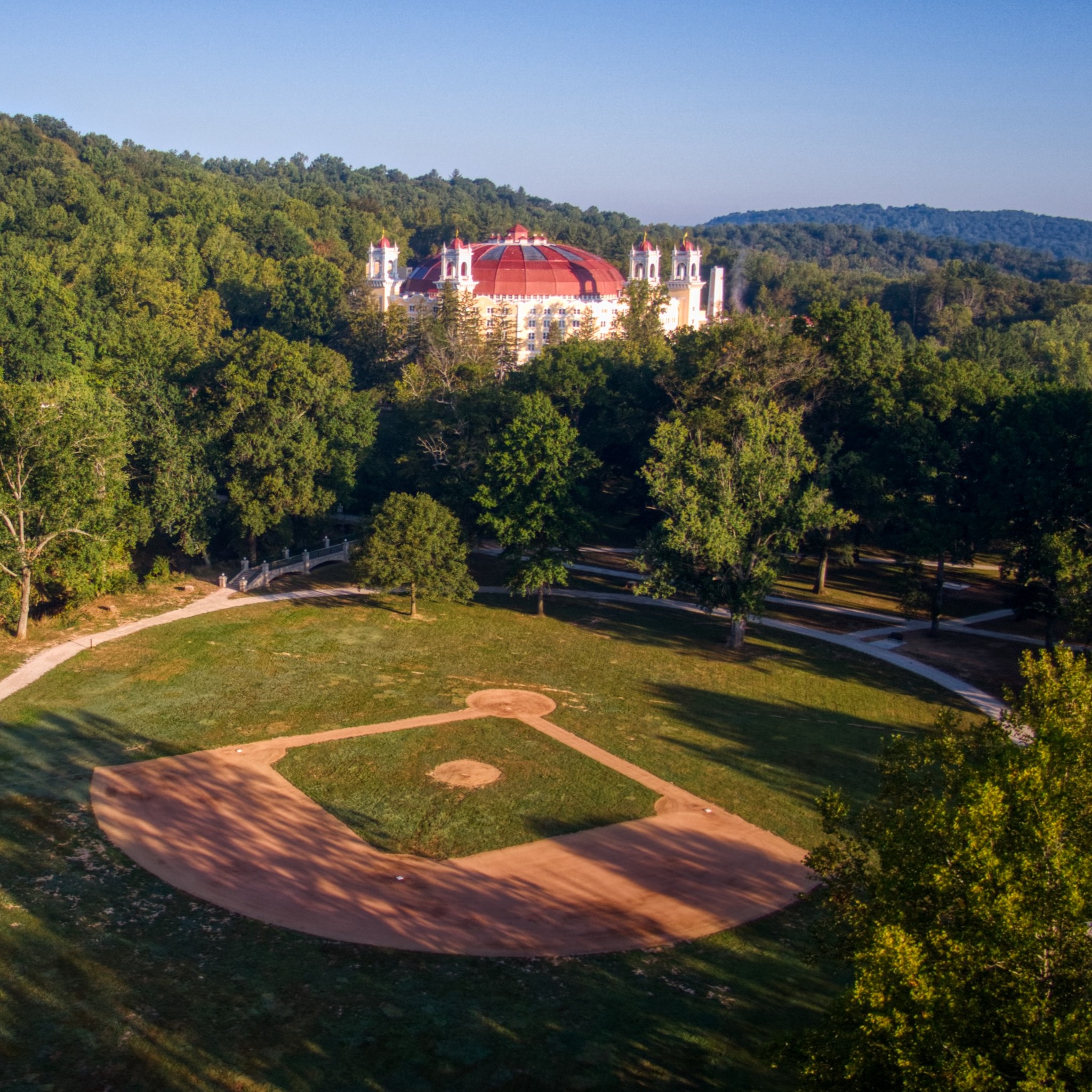 a baseball field and a building in the background