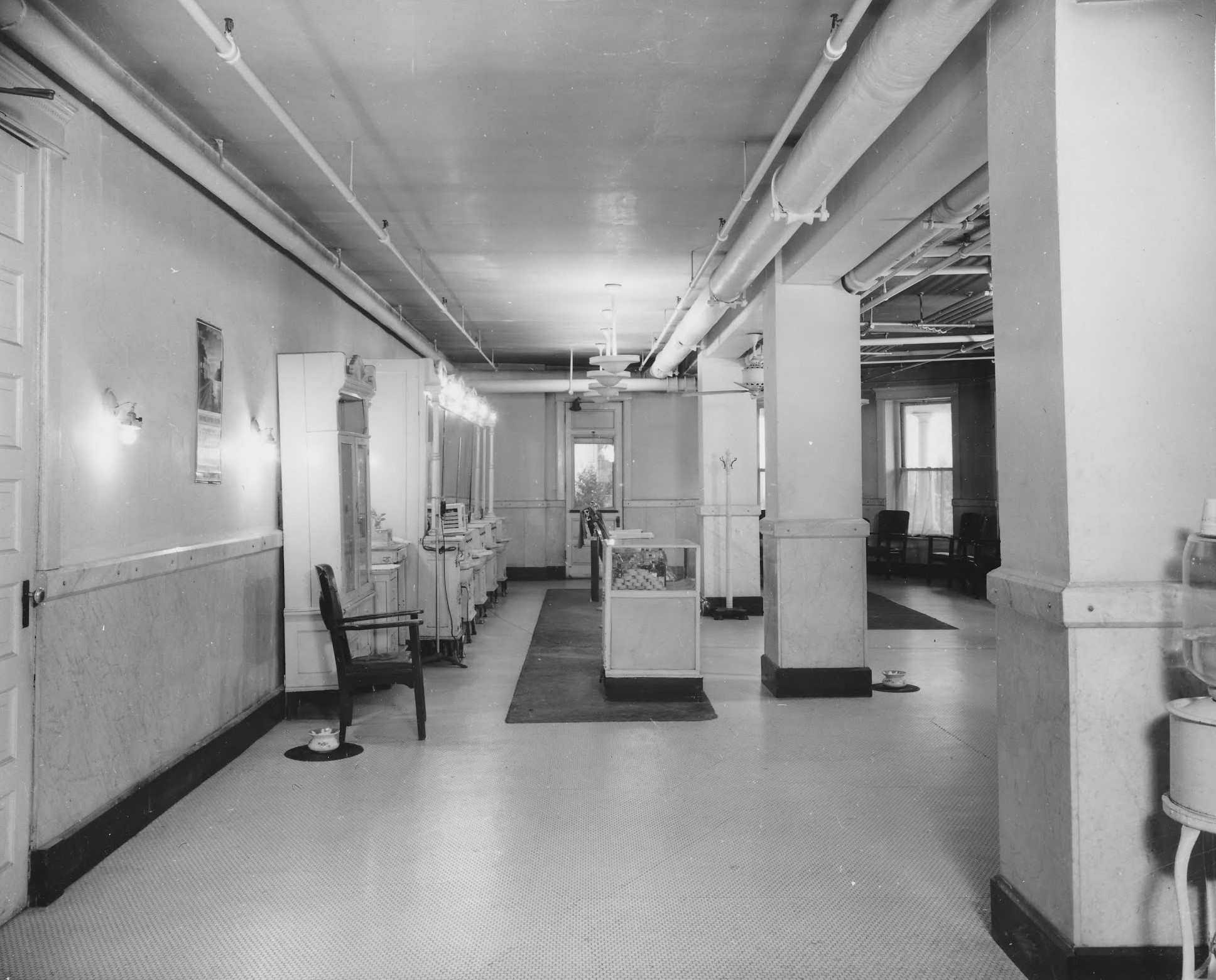 a black and white photo of a hallway