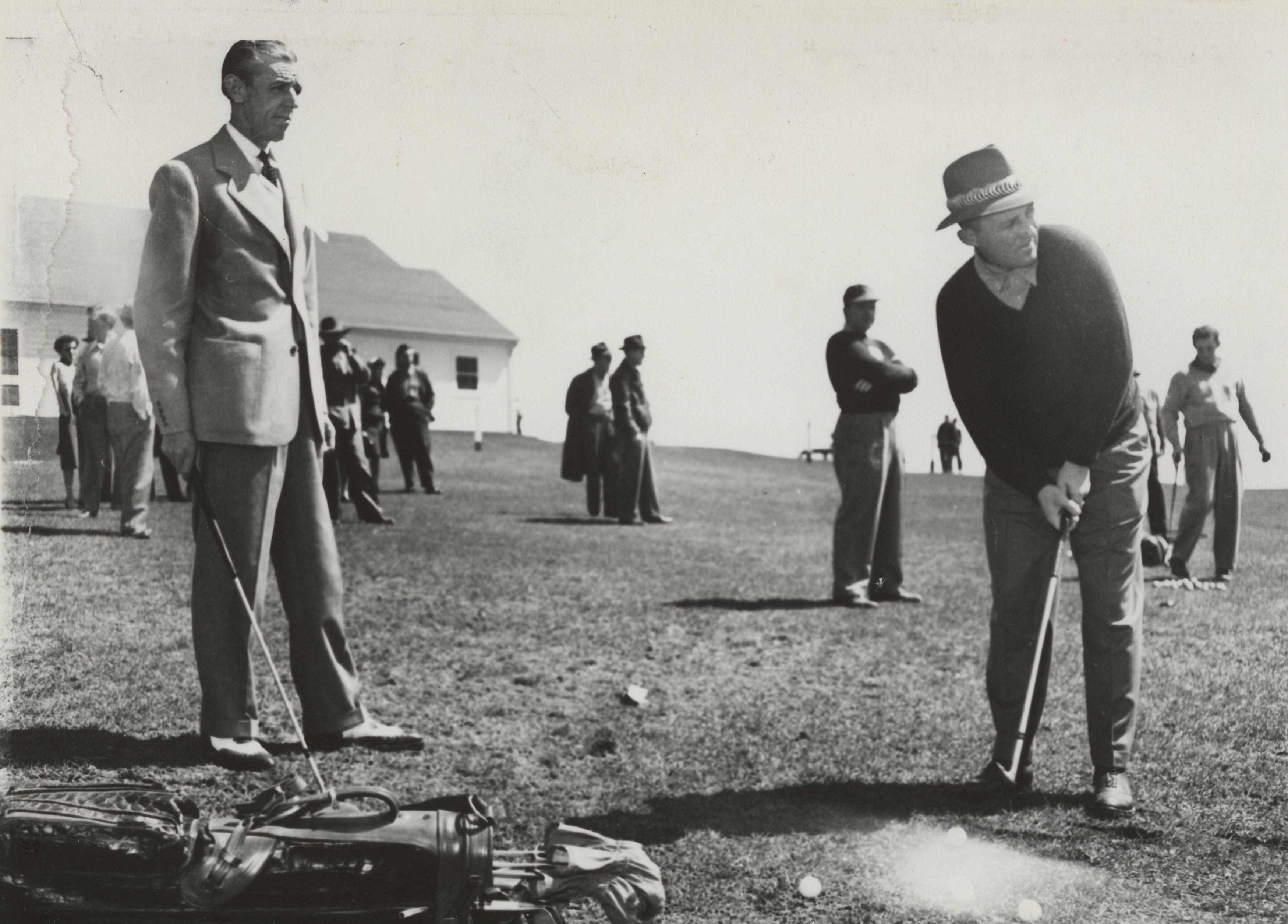 a group of men playing golf