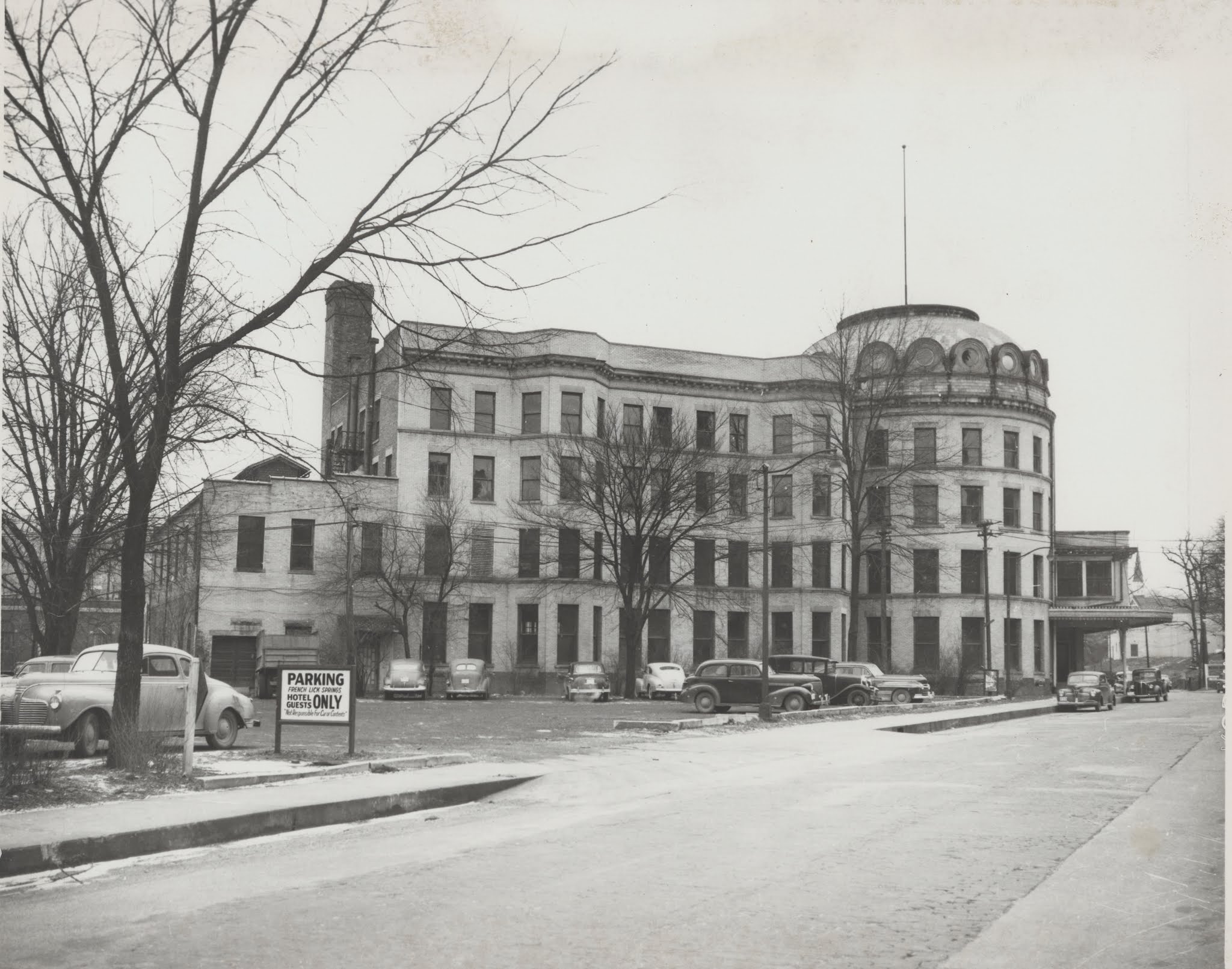 A black-and-white photo of a large hotel