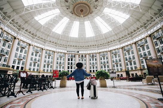 woman standing in center of west baden springs hotel
