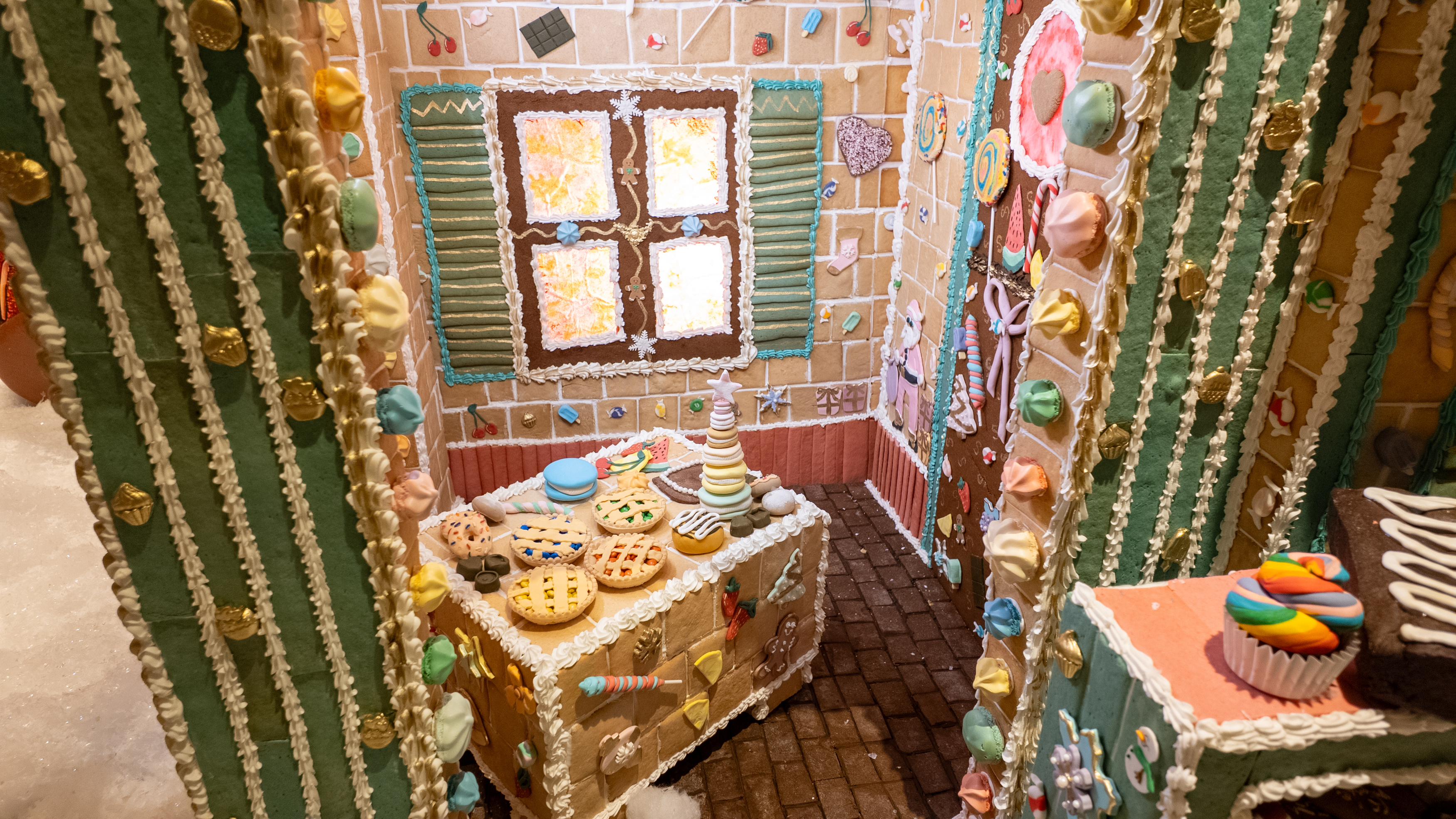a gingerbread house with a table and a window