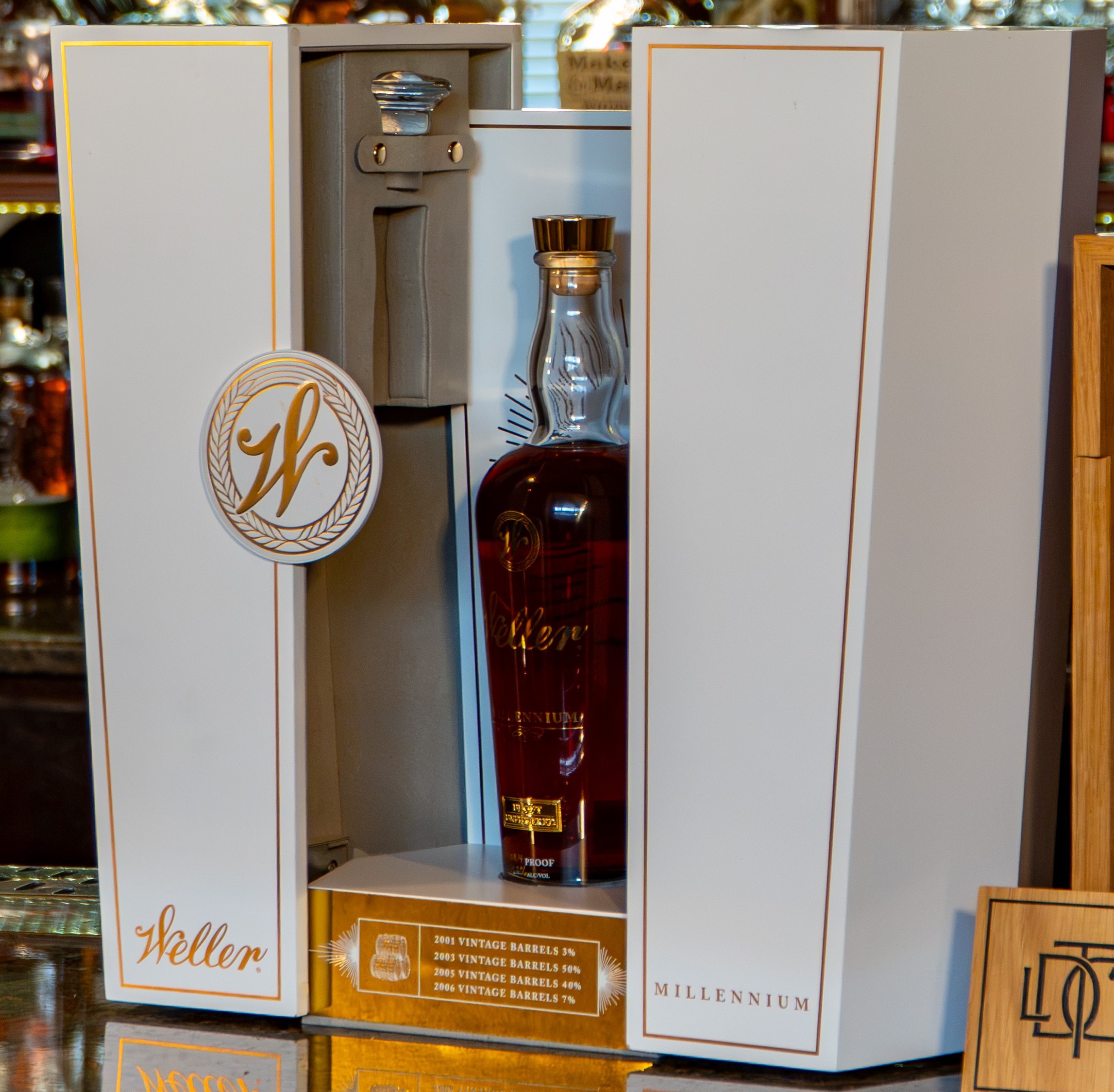 A bottle of liquor inside a case