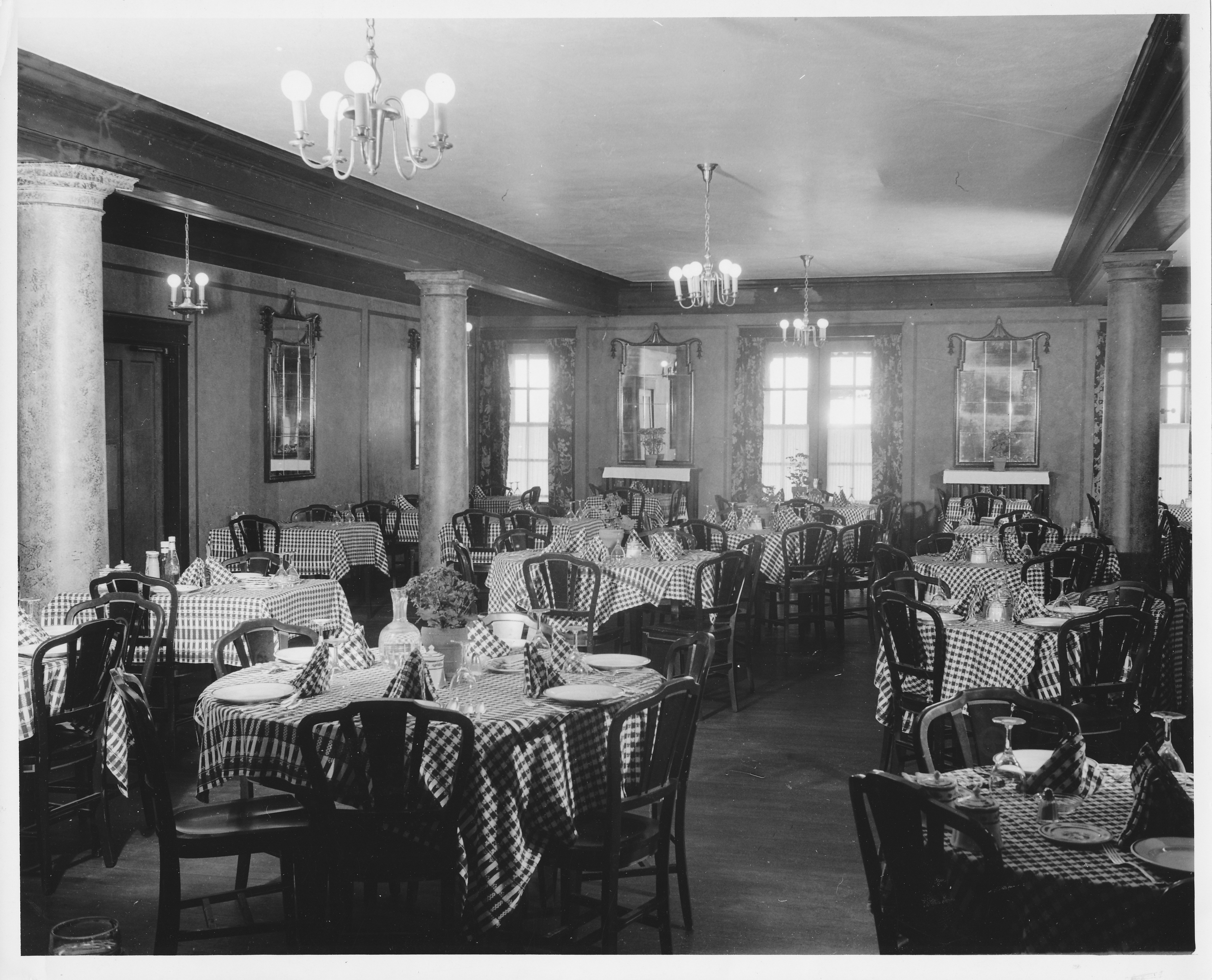 a restaurant with tables and chairs