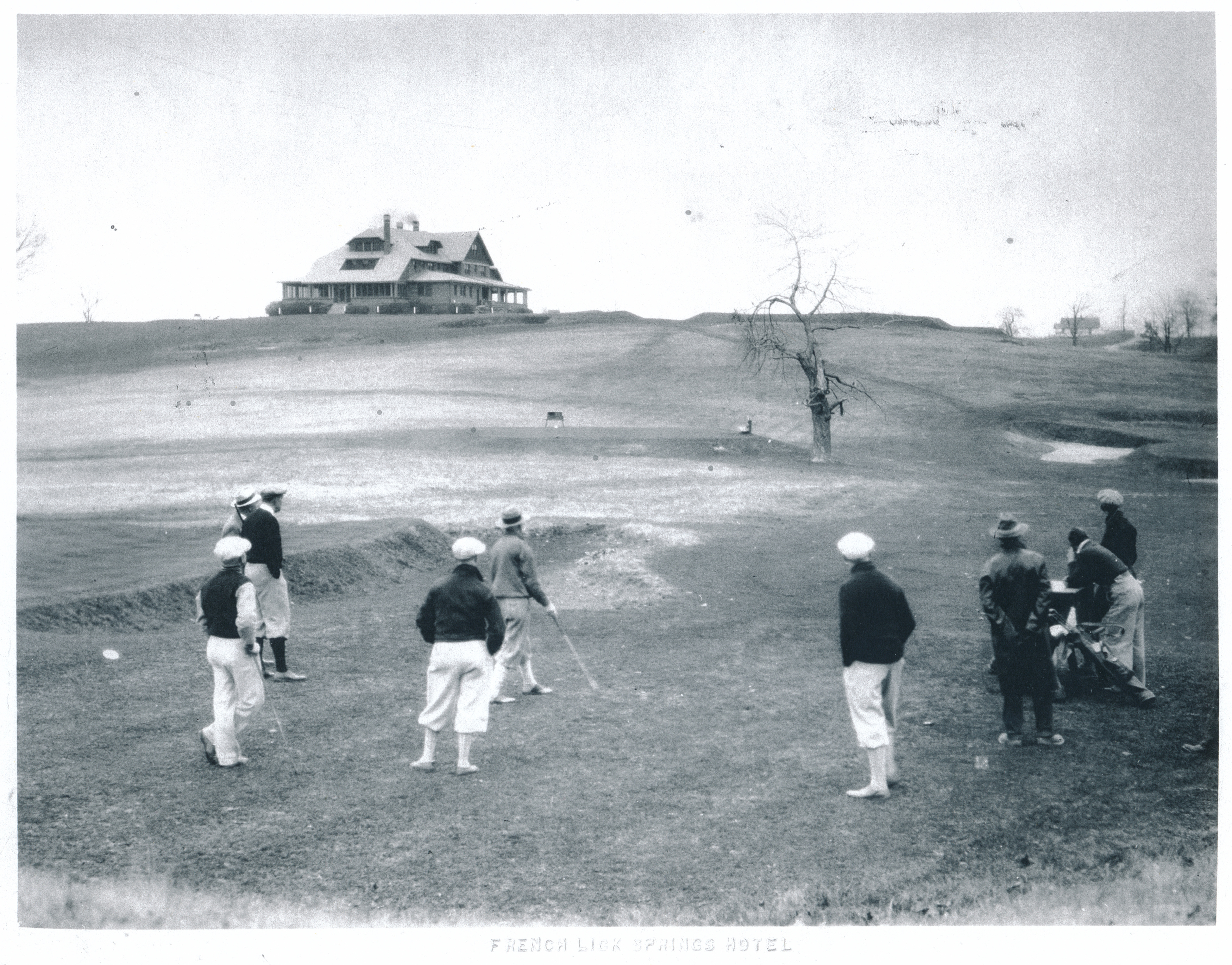 a group of people playing golf