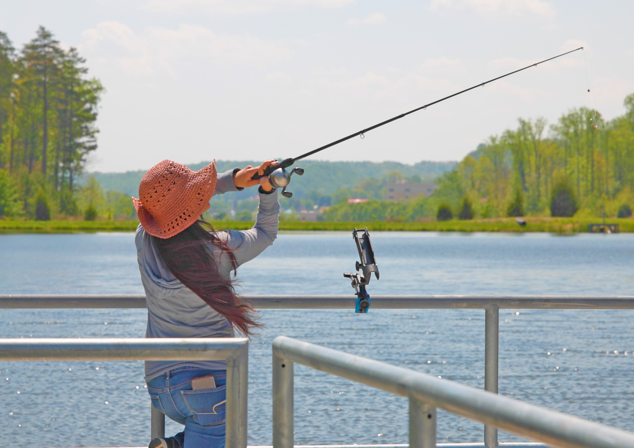 a woman fishing on a dock