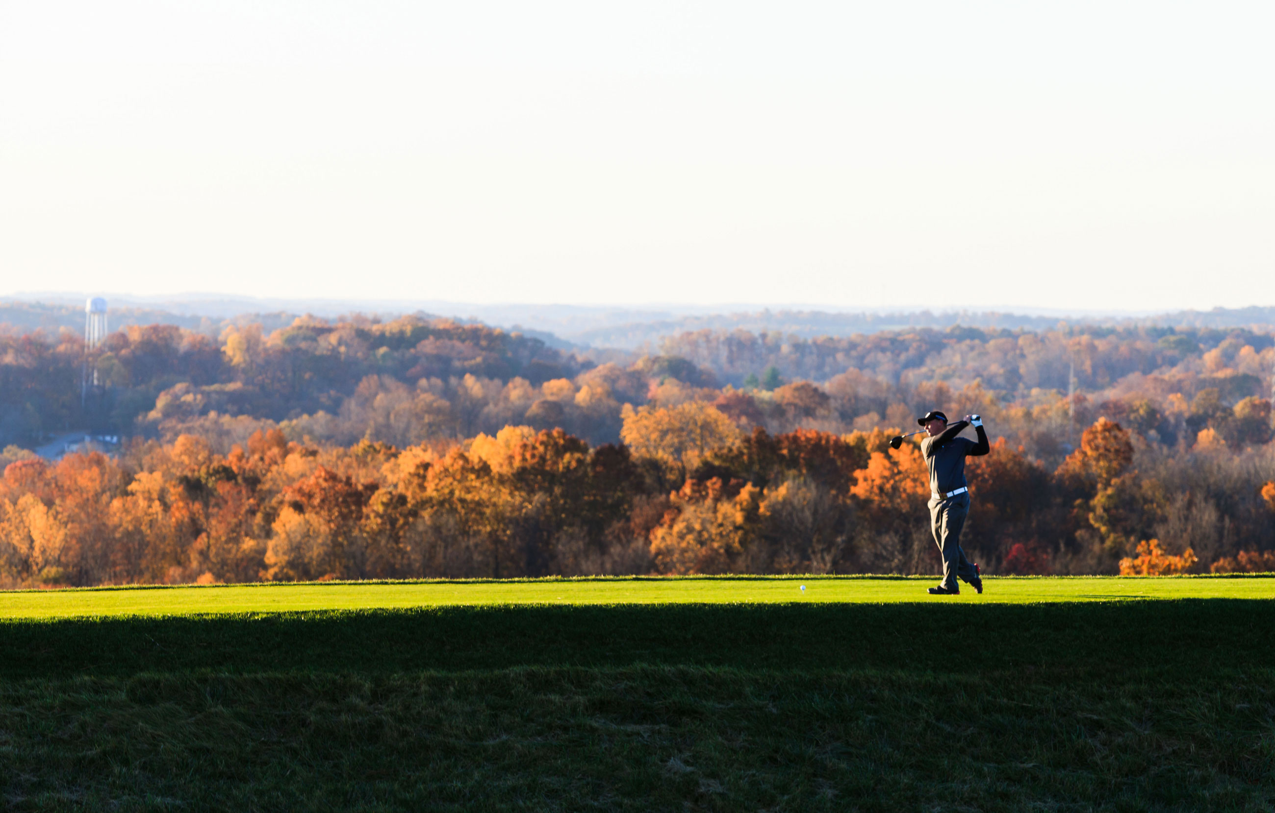 a man swinging a golf club