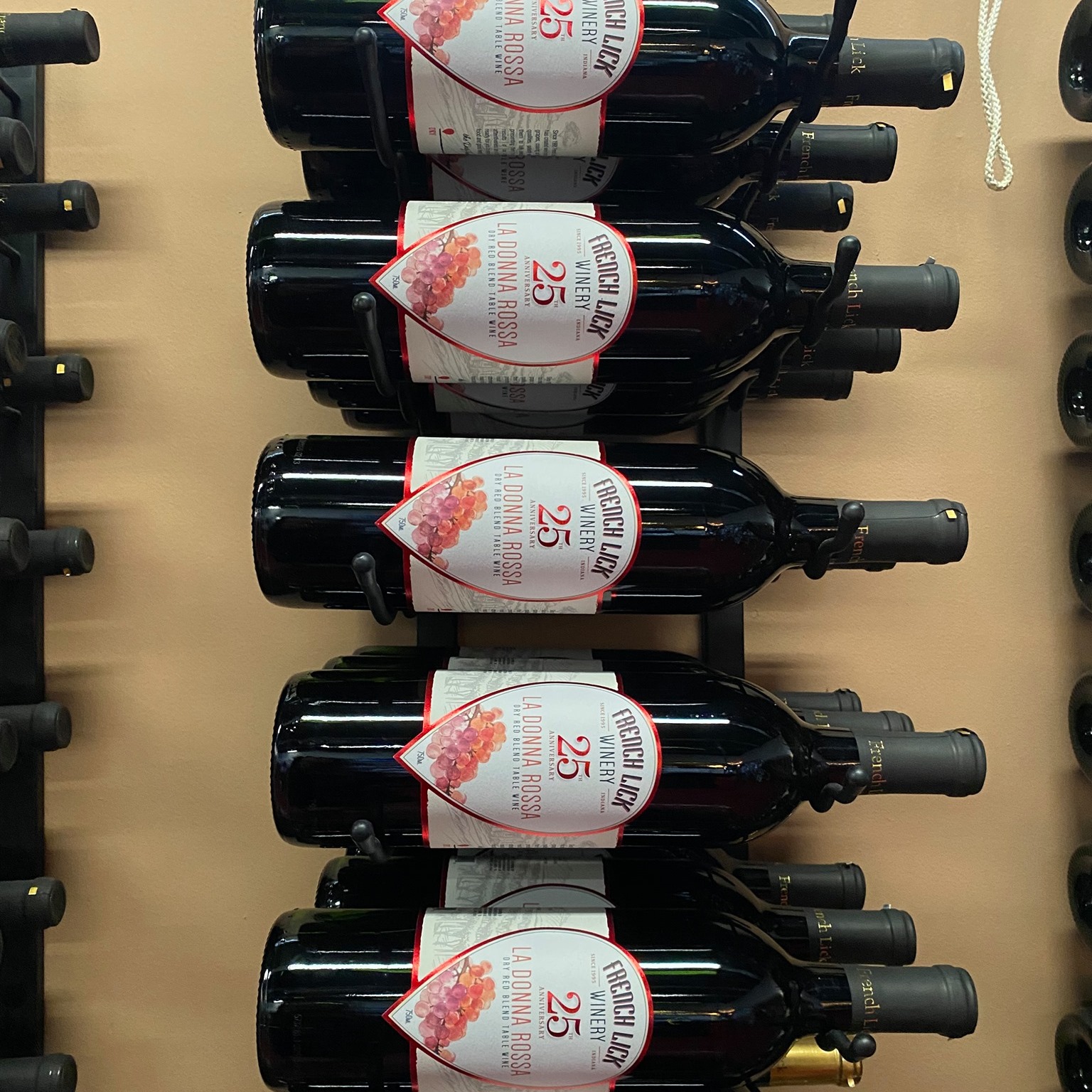 a row of wine bottles on a wall