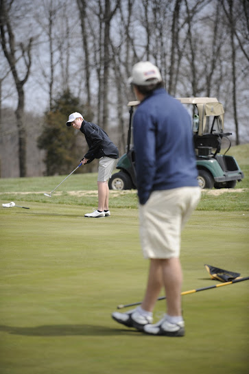 Father and Son Golfing