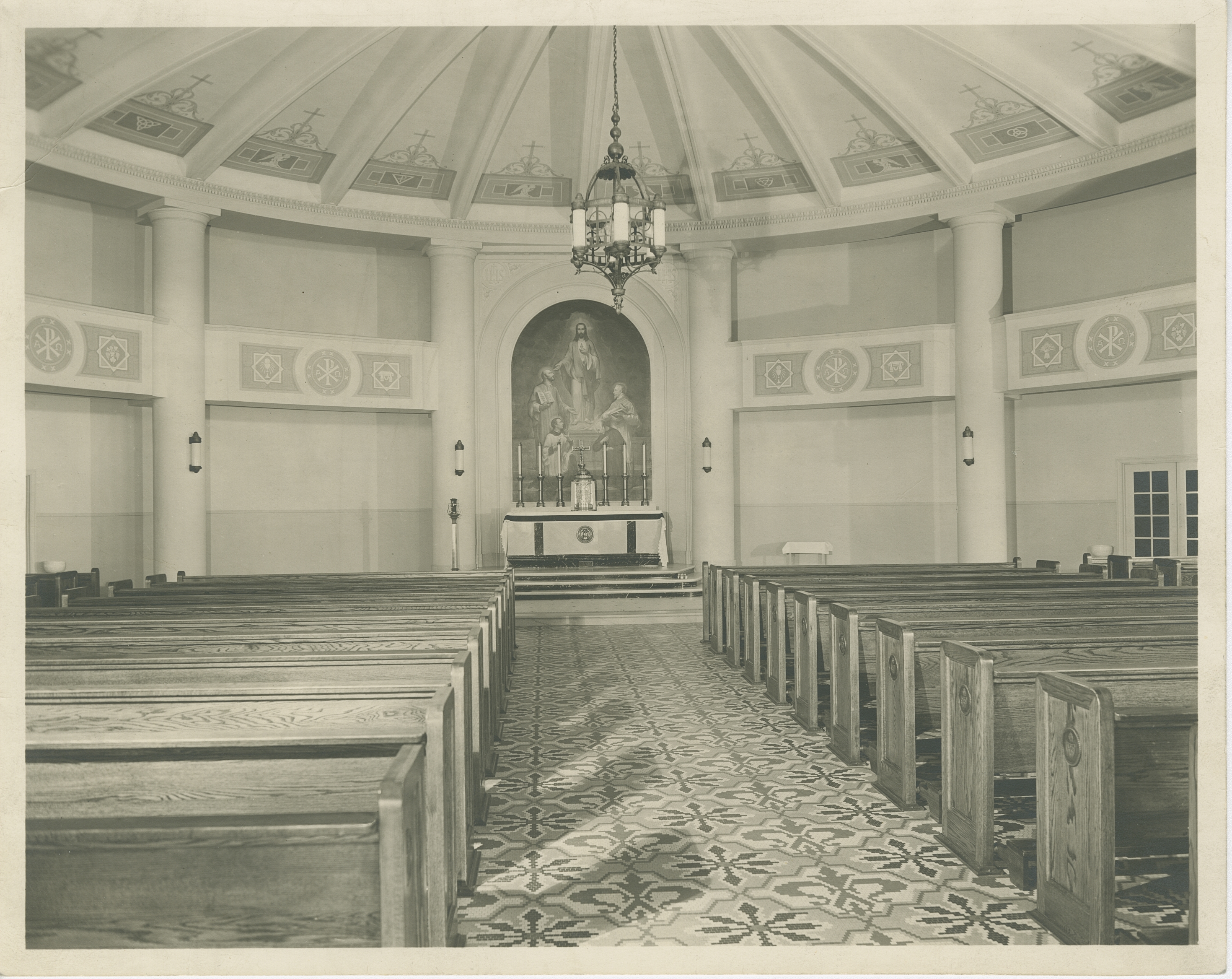 a church with pews and a chandelier