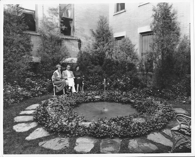 black and white photo garden fountain