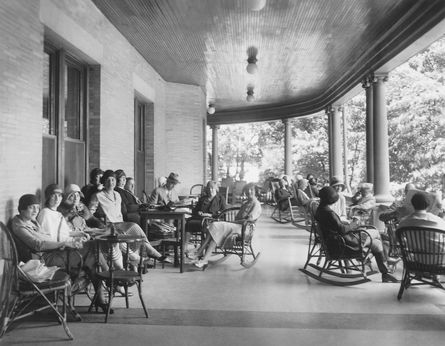 People sitting outside a hotel