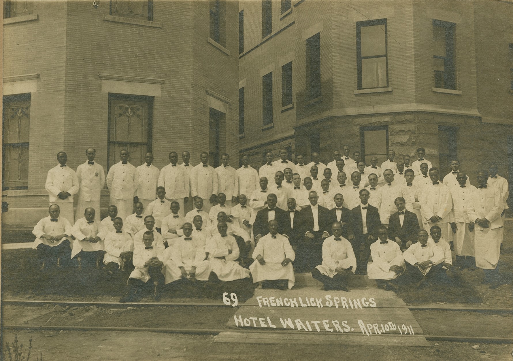 a group of men in white shirts and ties