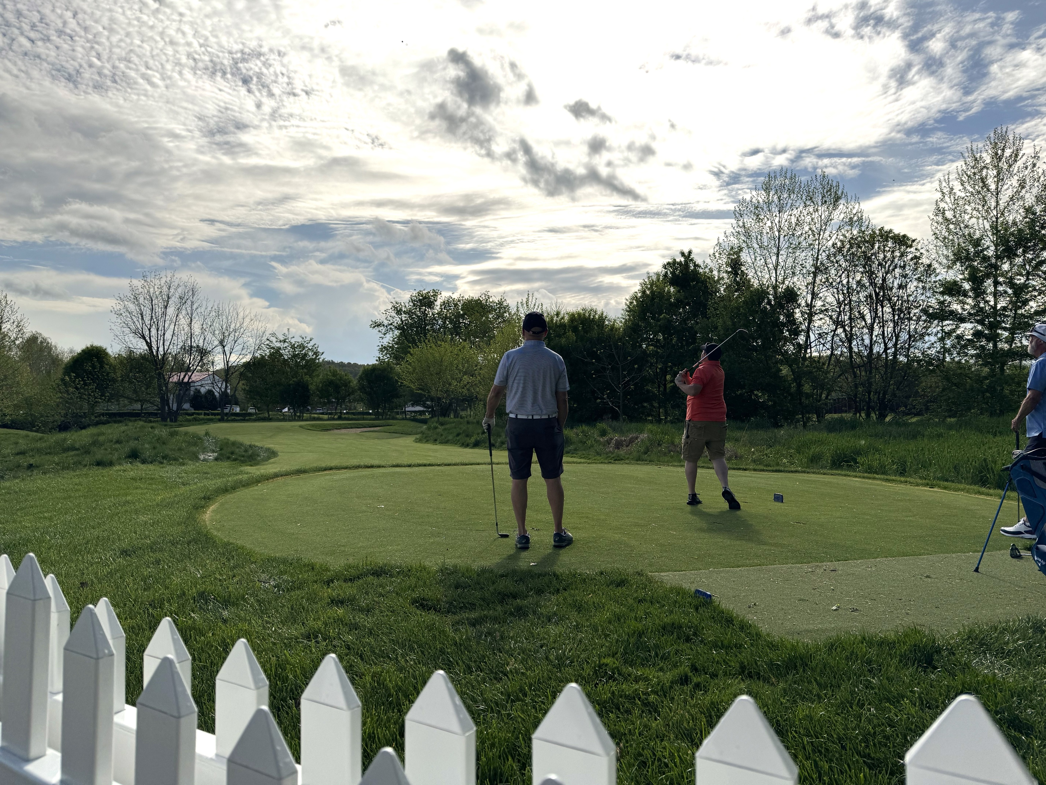 a group of men playing golf