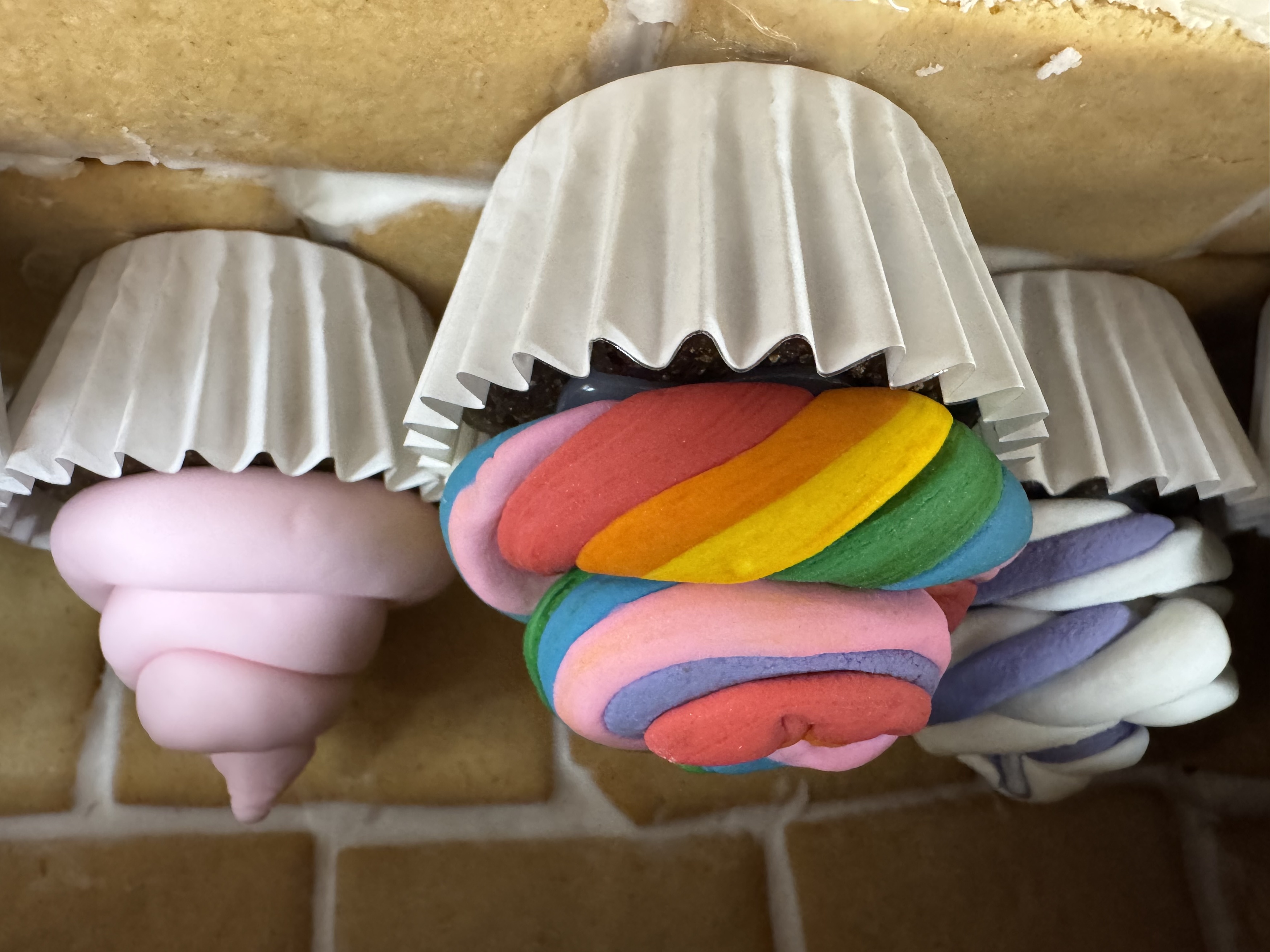 a group of cupcakes with frosting