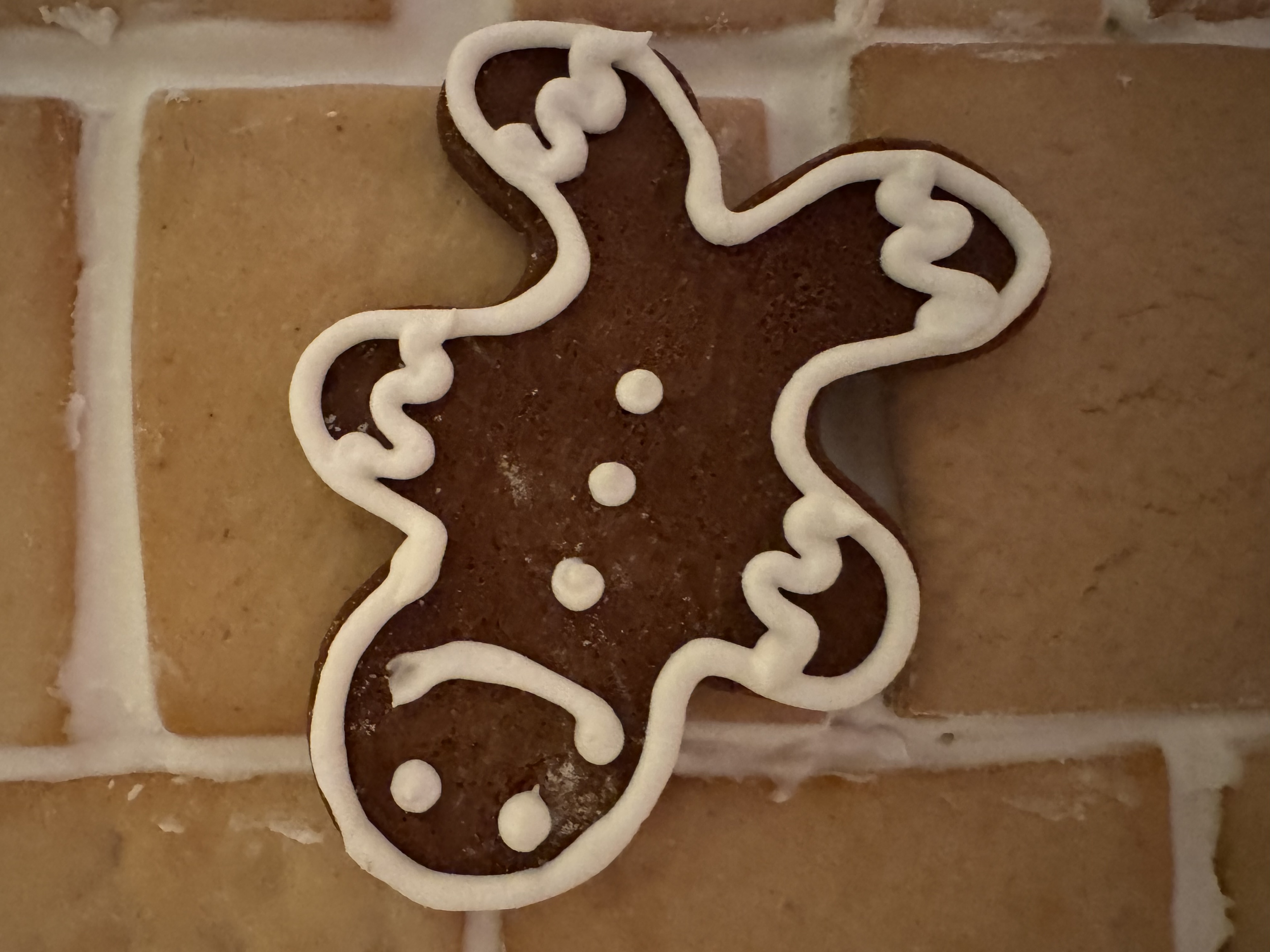 A gingerbread man on a house