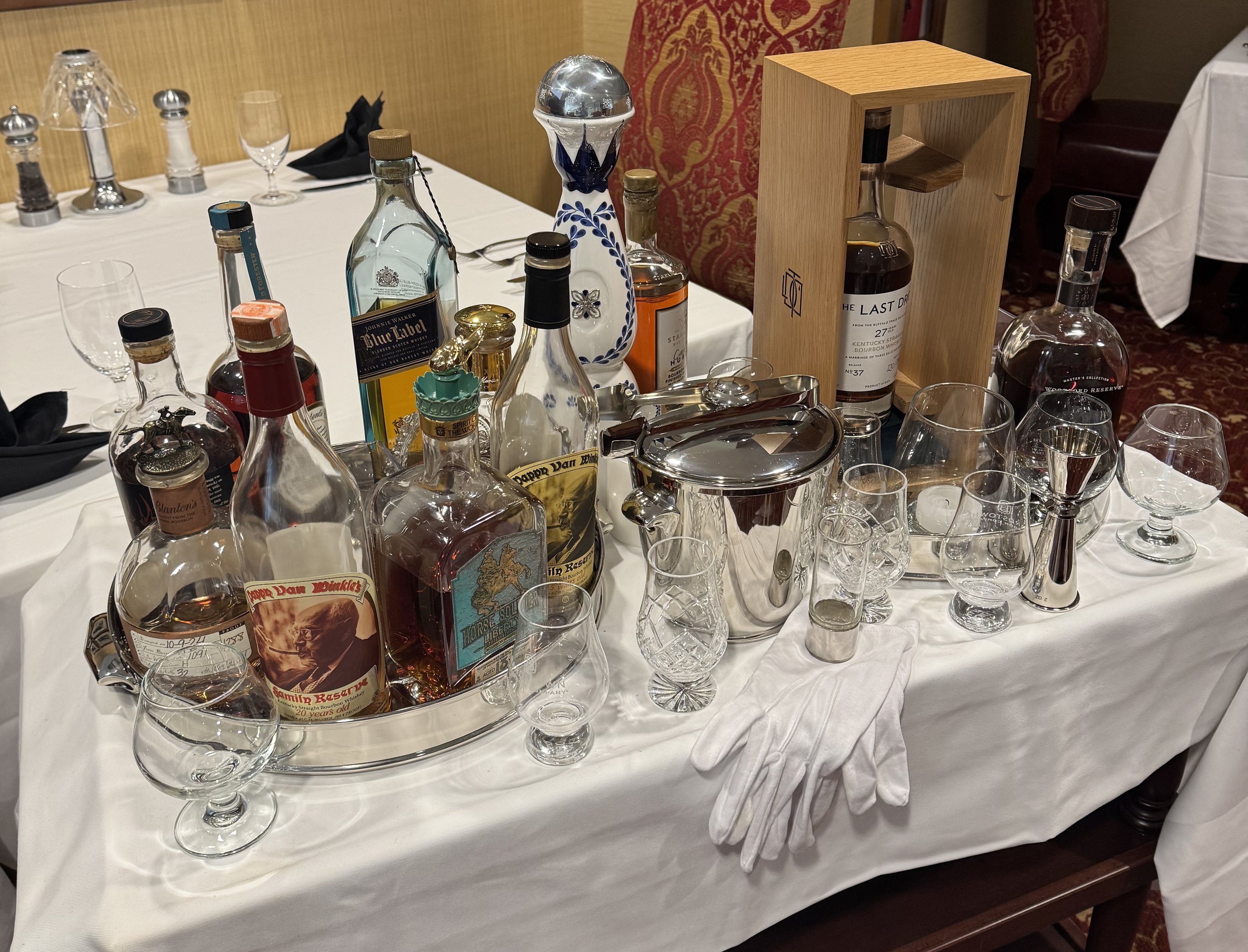 a table with a group of bottles and glasses
