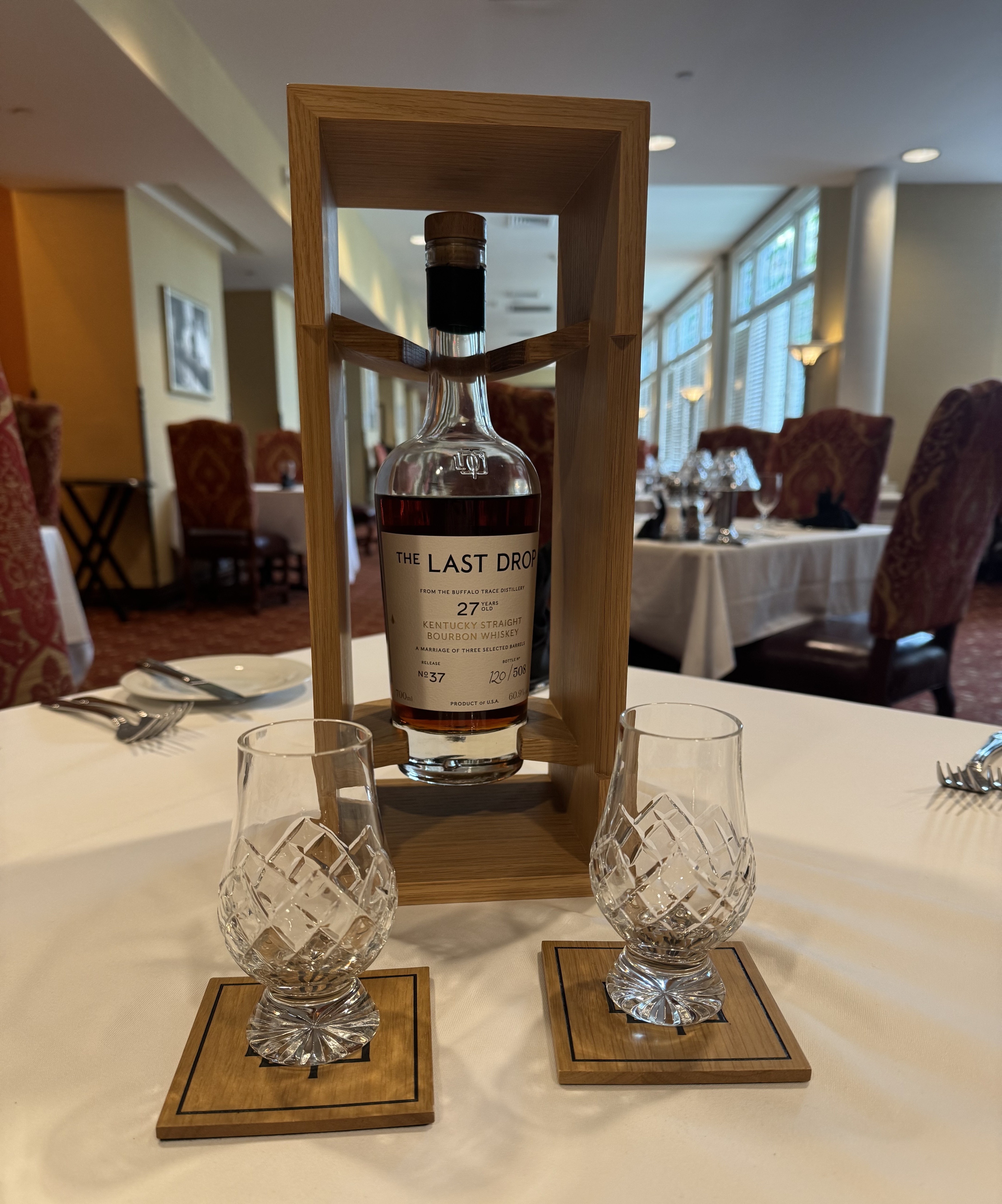 Bourbon bottle and glasses on a table