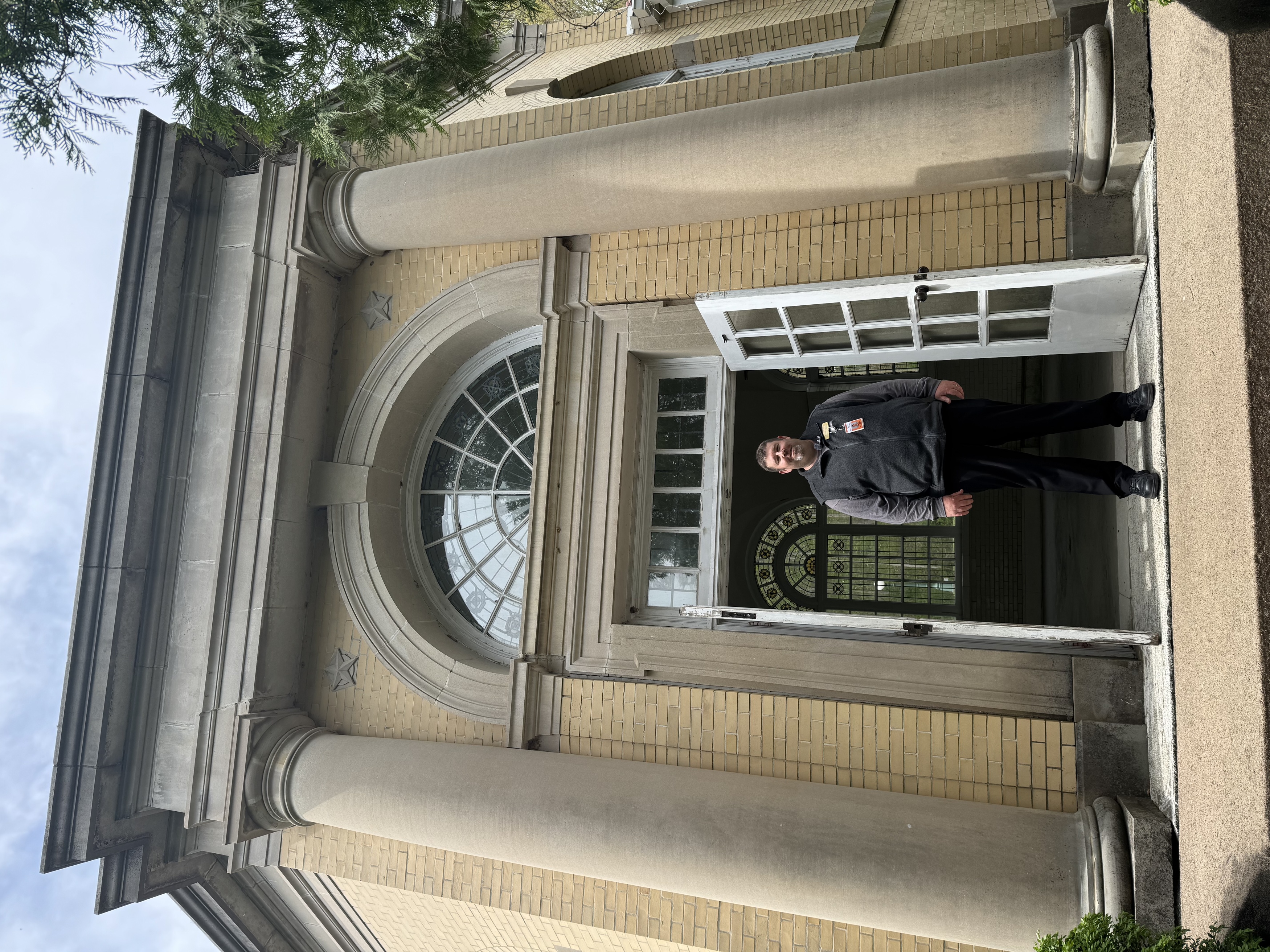 a man standing in front of a building
