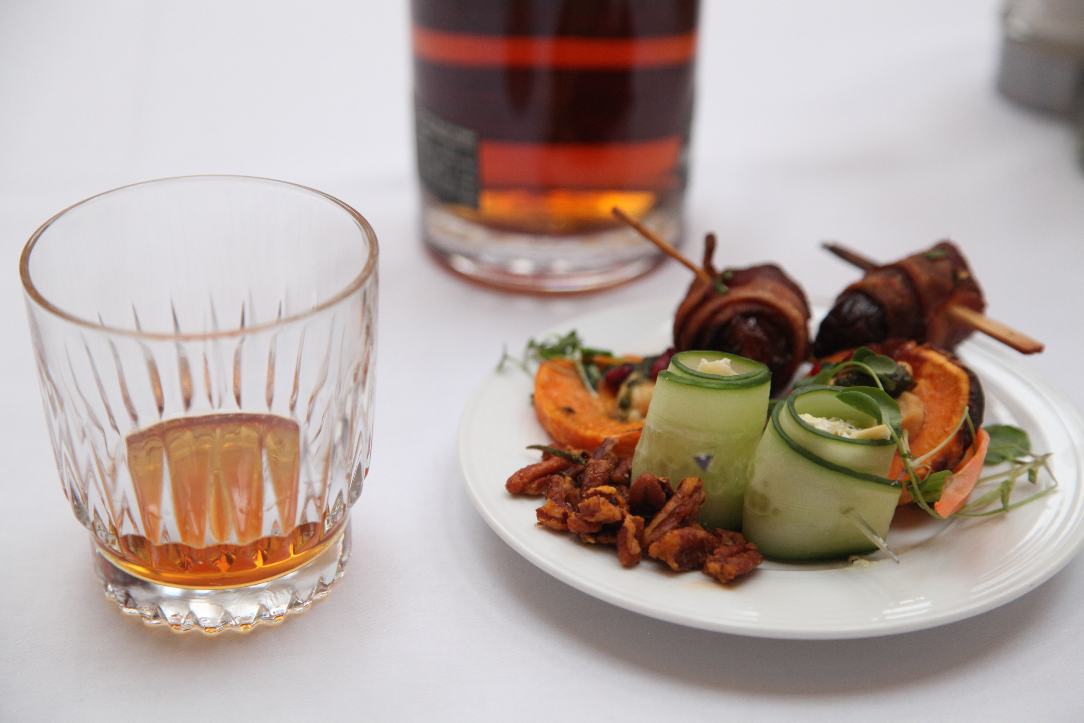a plate of food and a glass of alcohol